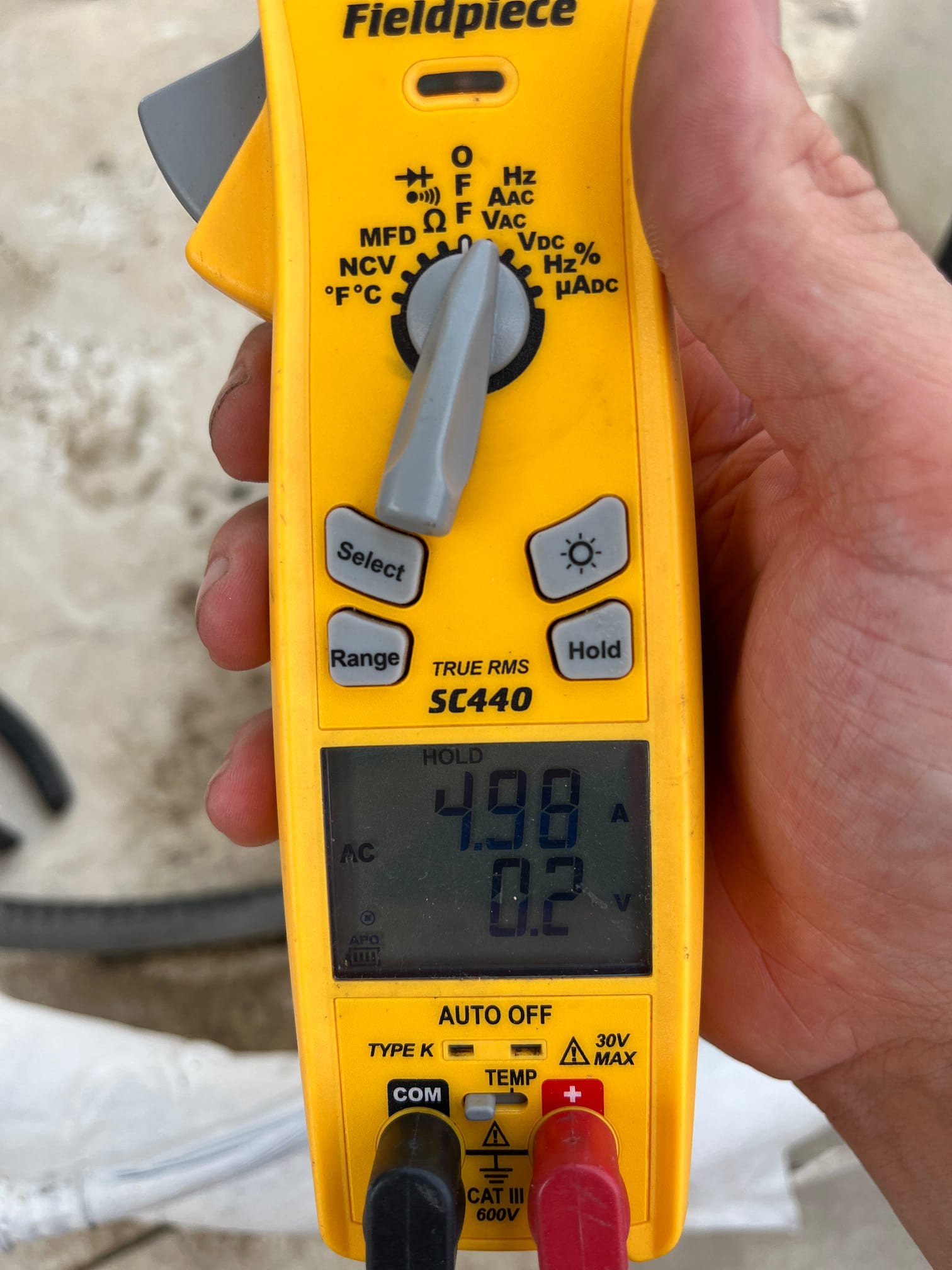 HVAC diagnostic instrument photographed during the service visit.