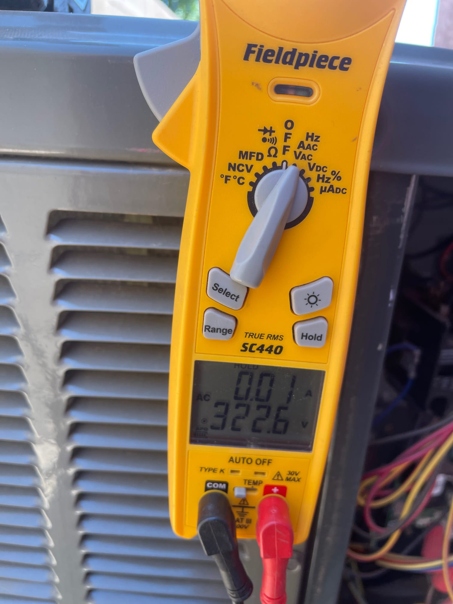 HVAC diagnostic instrument photographed during the service visit.