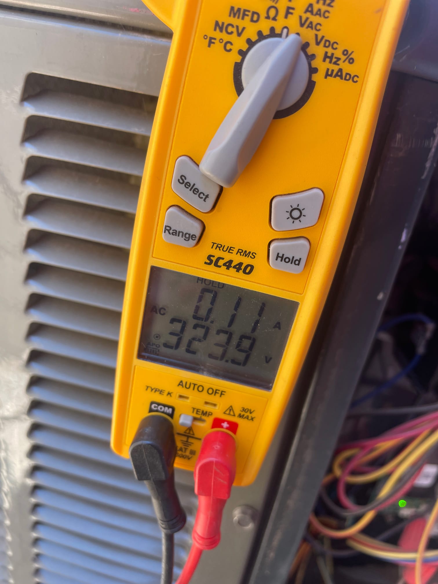 HVAC diagnostic instrument photographed during the service visit.