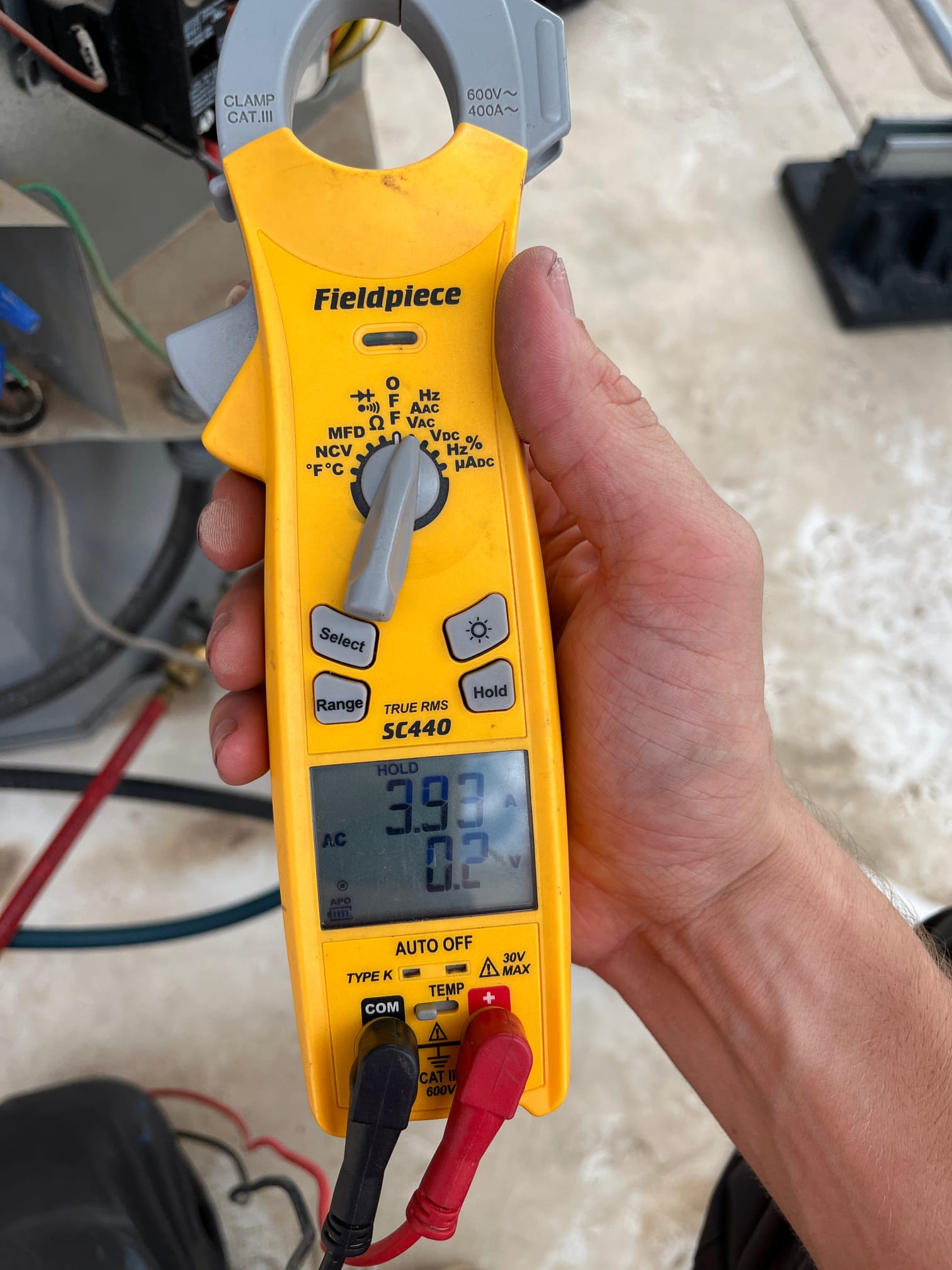 HVAC diagnostic instrument photographed during the service visit.