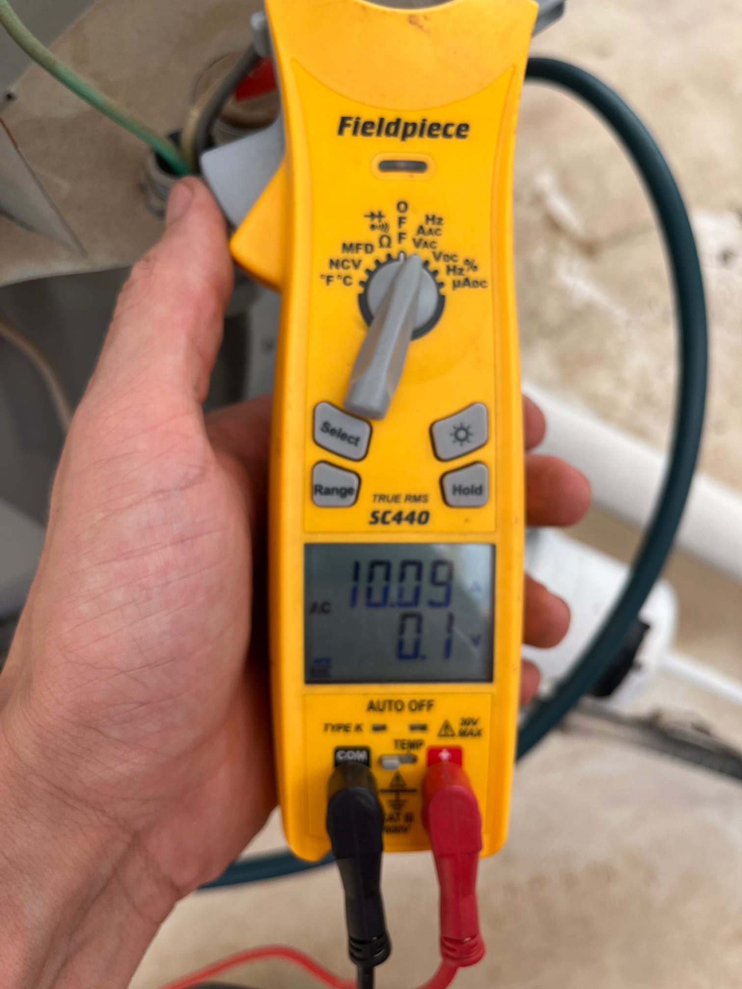 HVAC diagnostic instrument photographed during the service visit.