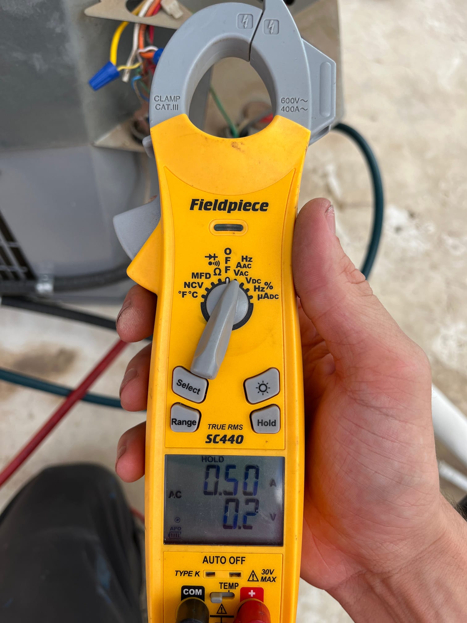 HVAC diagnostic instrument photographed during the service visit.