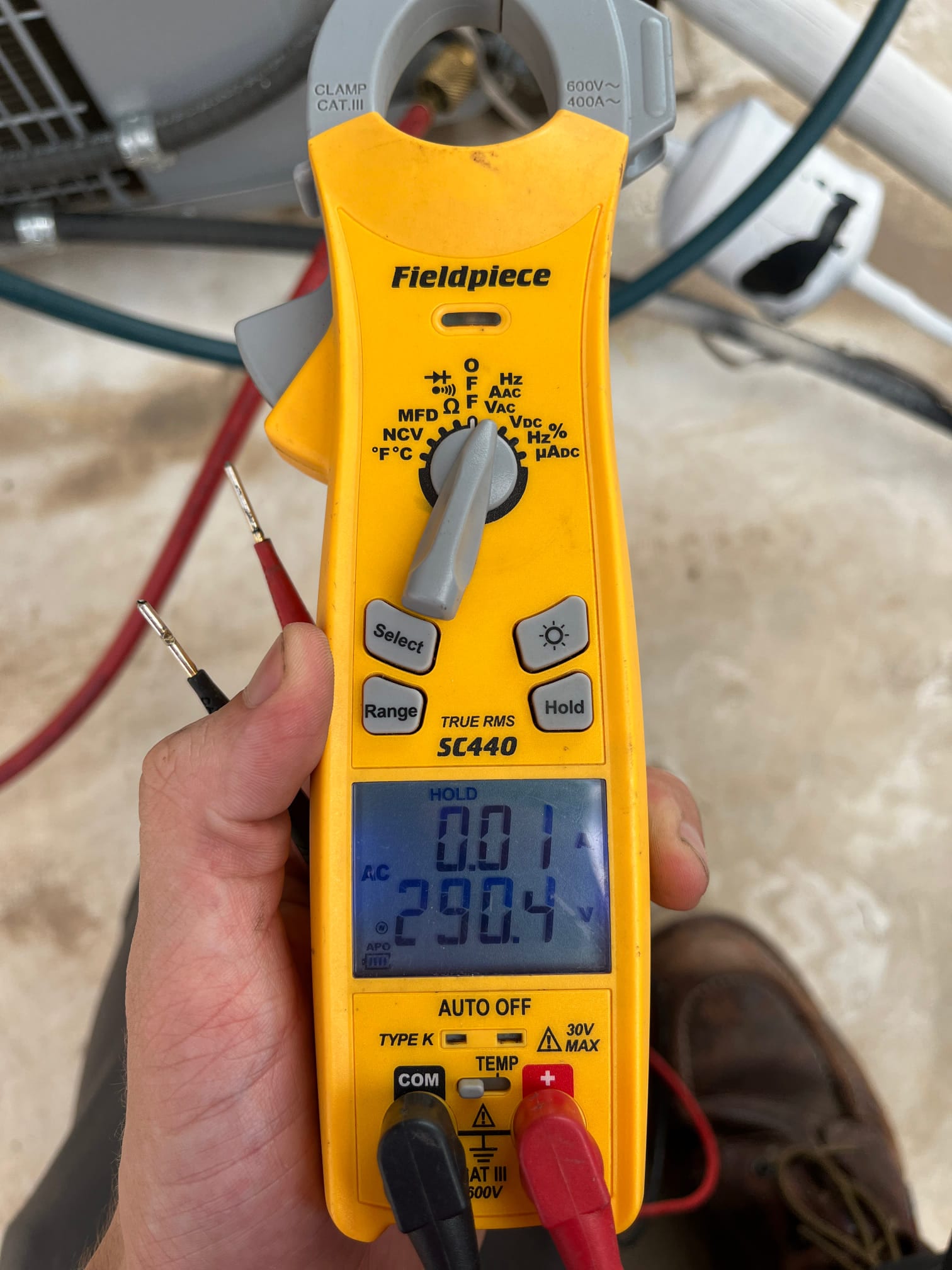 HVAC diagnostic instrument photographed during the service visit.