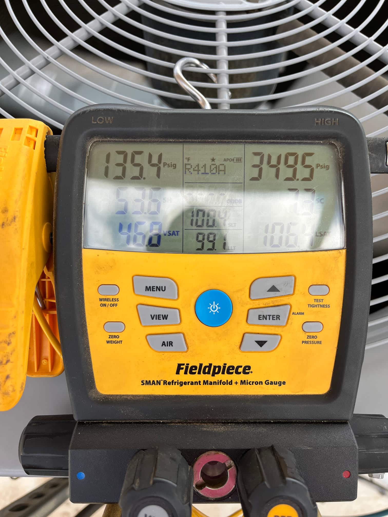 HVAC diagnostic instrument photographed during the service visit.