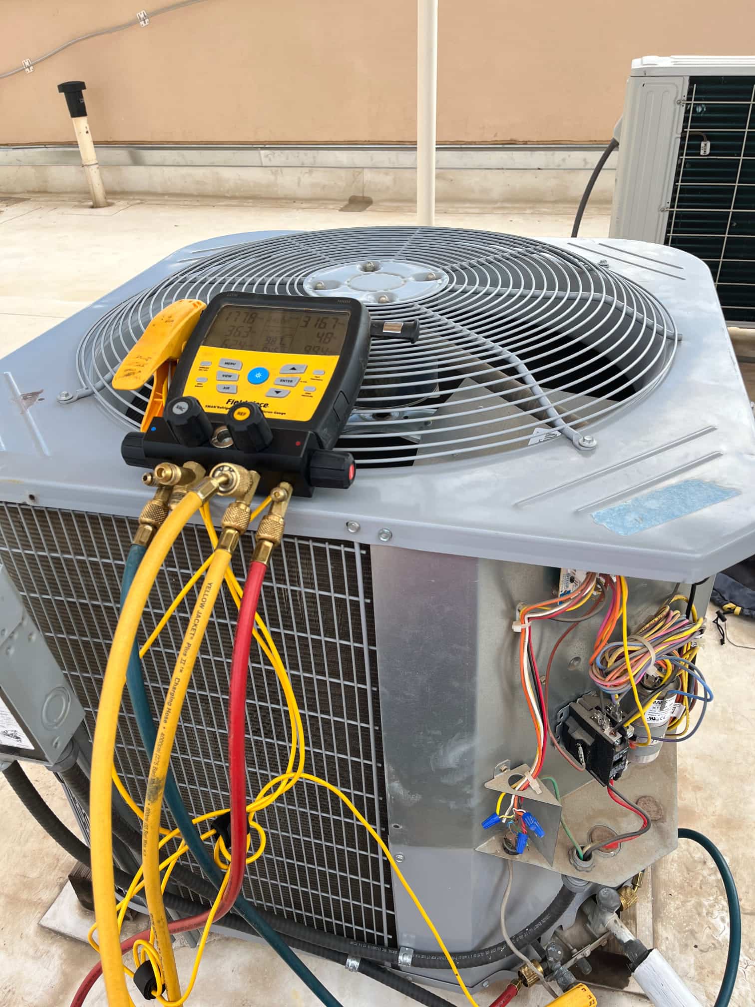 HVAC diagnostic instrument photographed during the service visit.