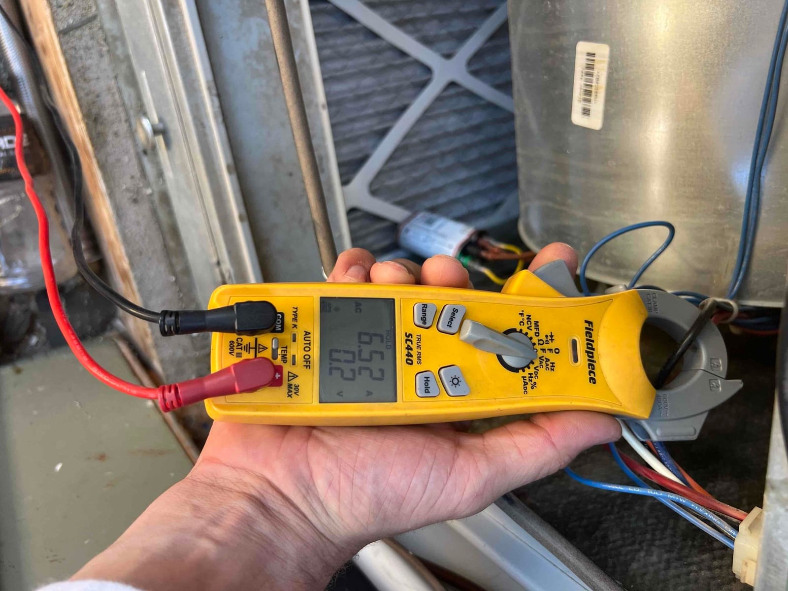 Diagnostic instrument display shows 6.52 A.