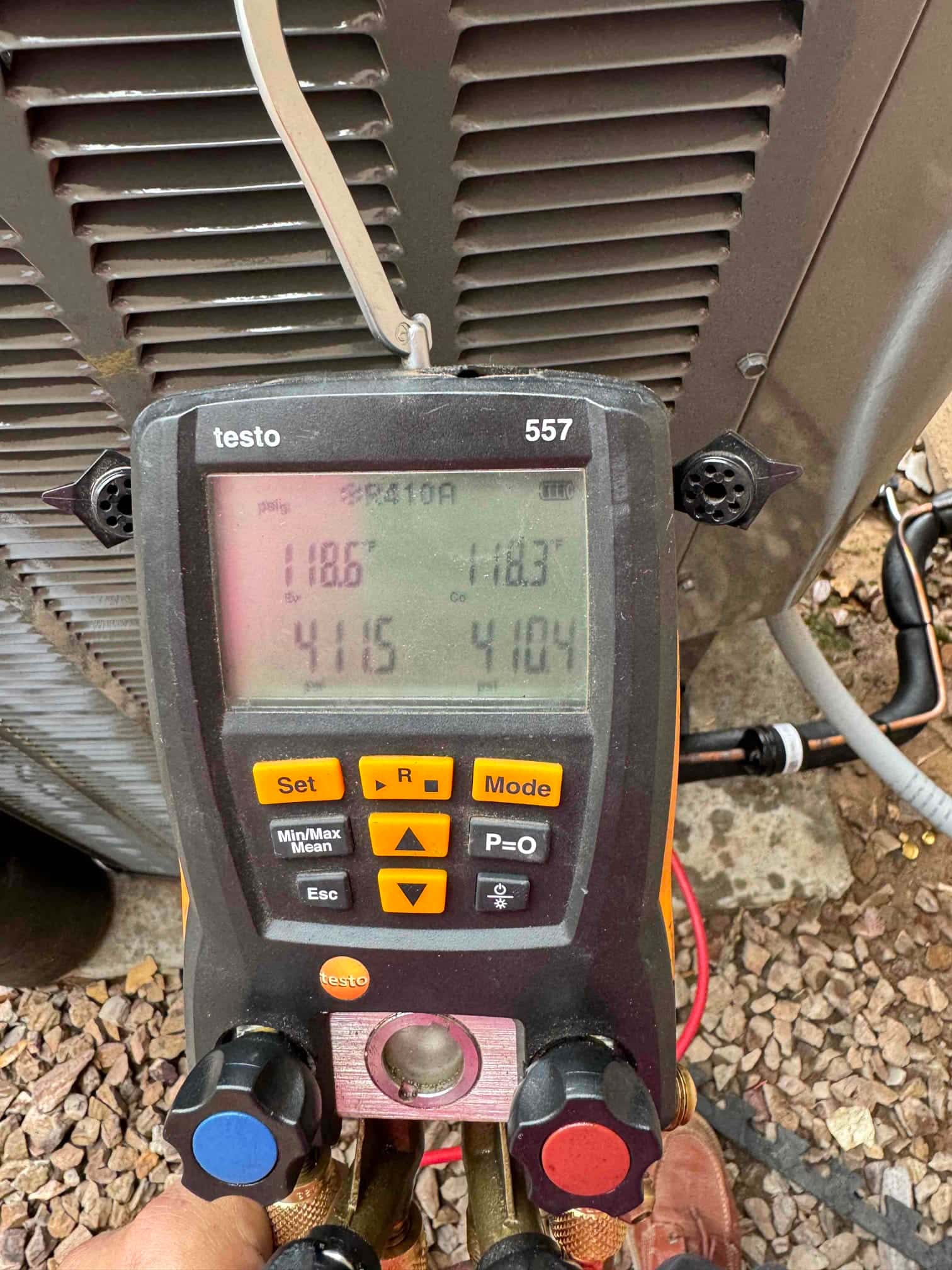 Digital manifold gauges show equal pressures at 415 PSI on both sides during a nitrogen pressure test of the new system.