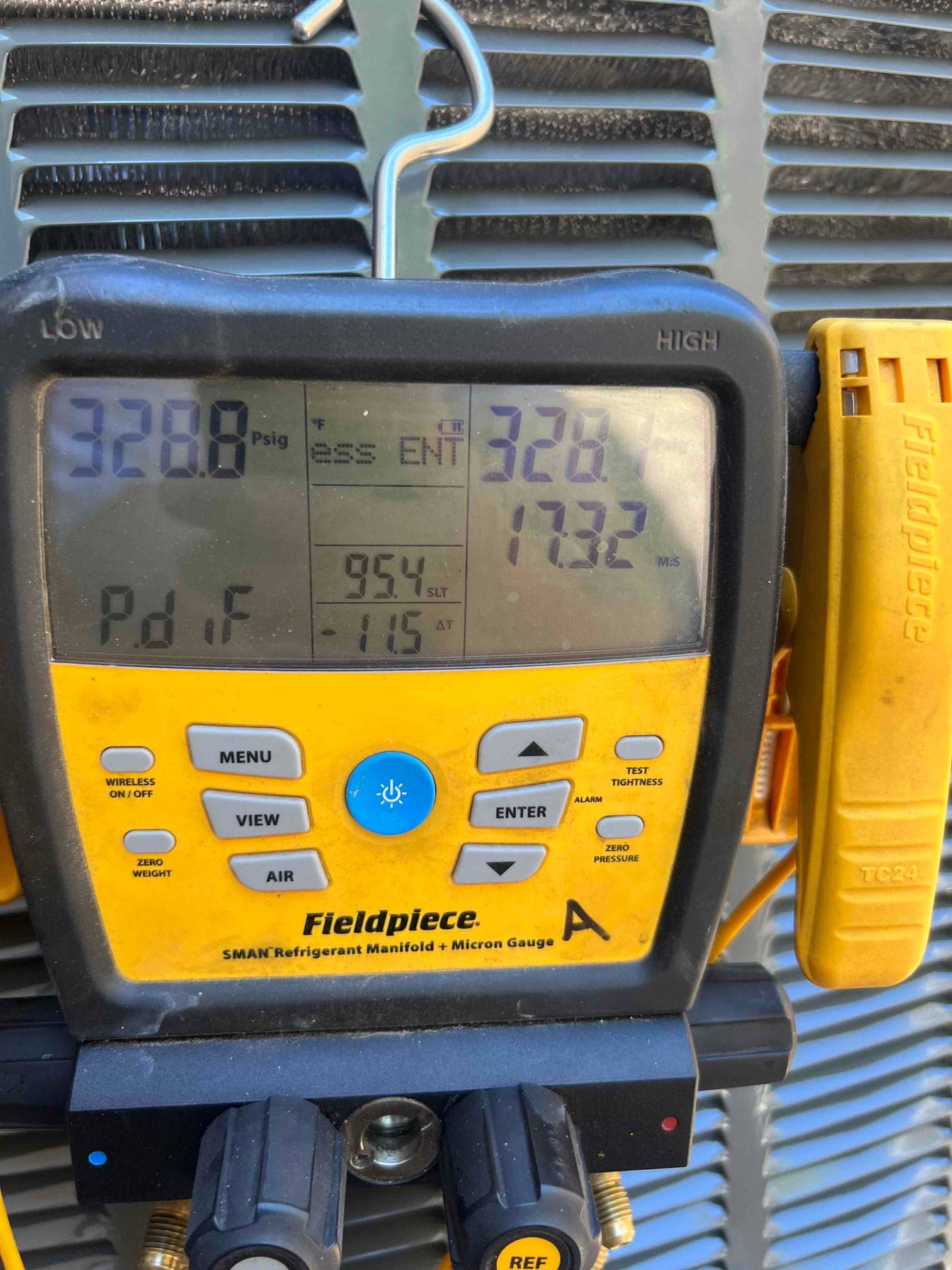 Digital manifold shows equal pressures of 328 PSI on both sides, documenting a nitrogen pressure test on the new system.