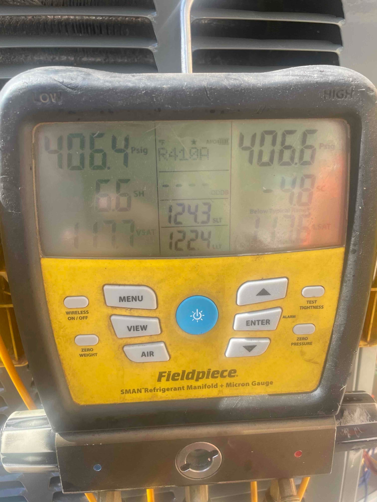 Digital manifold shows both high and low sides holding around 406 PSI during a nitrogen pressure test on the new system.