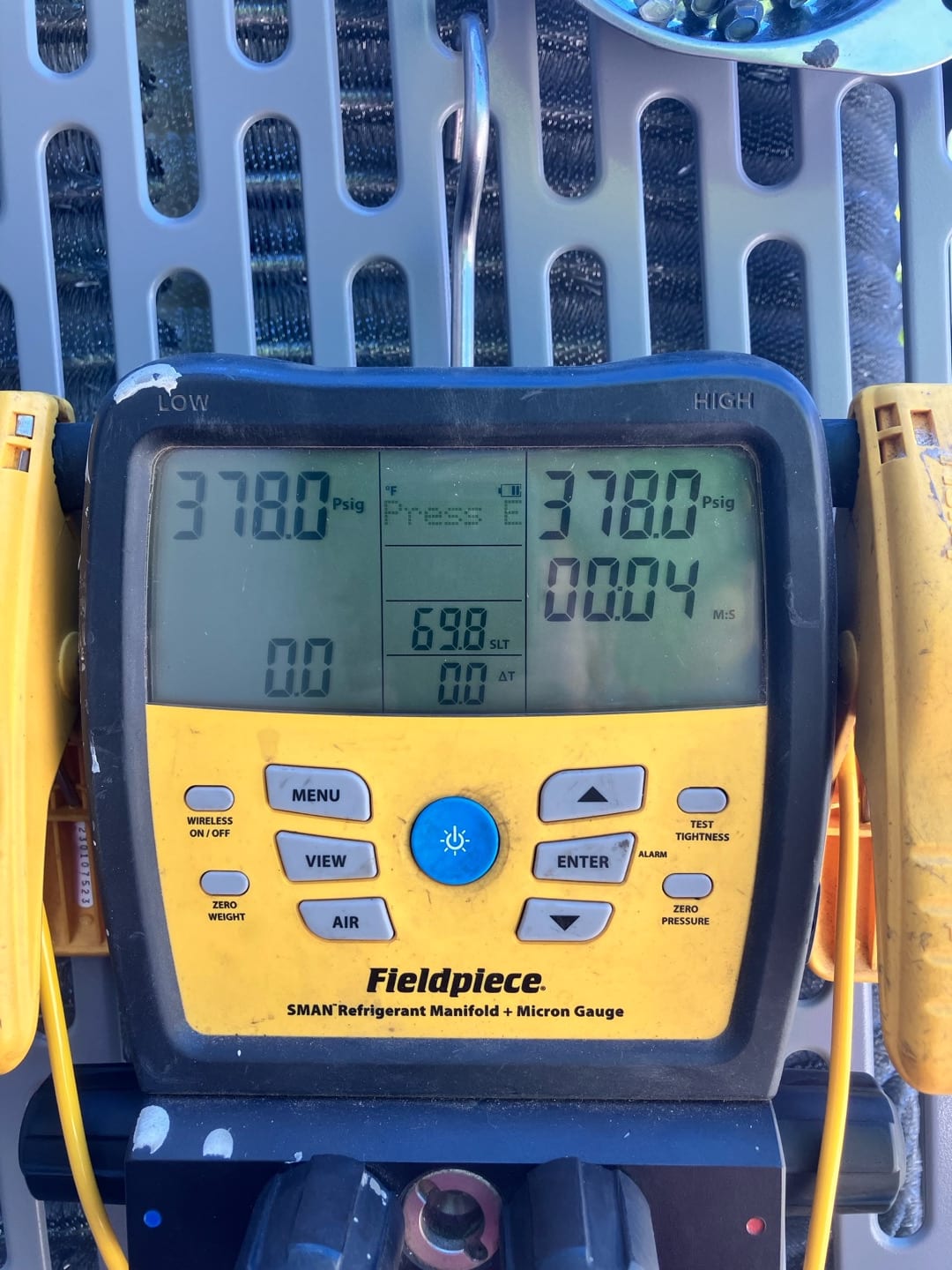 Digital manifold shows both low and high sides holding 378 PSI during a nitrogen pressure test on the new system.
