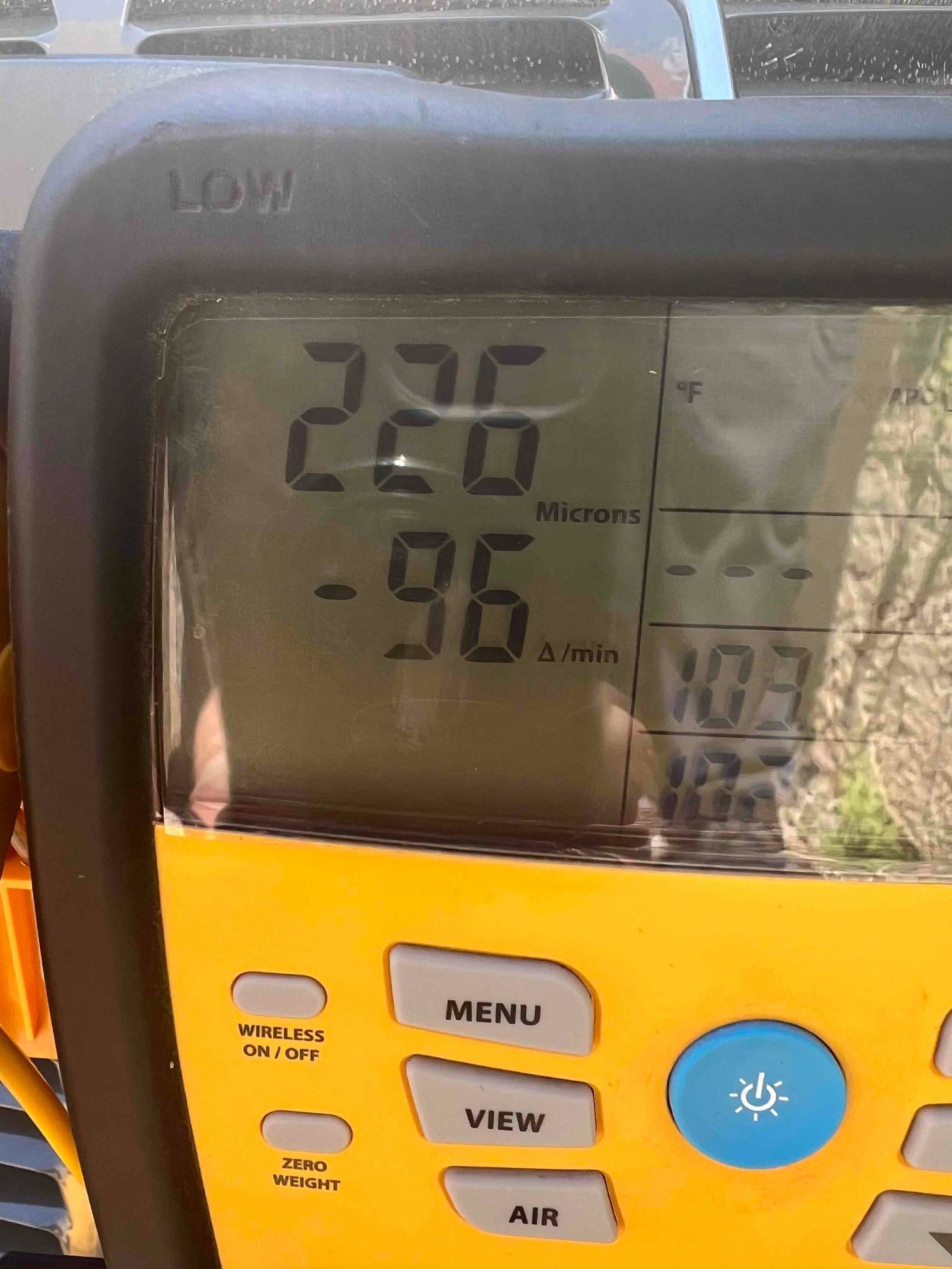 Digital micron gauge displays 226 microns with a -96 microns per minute decay rate during system evacuation.