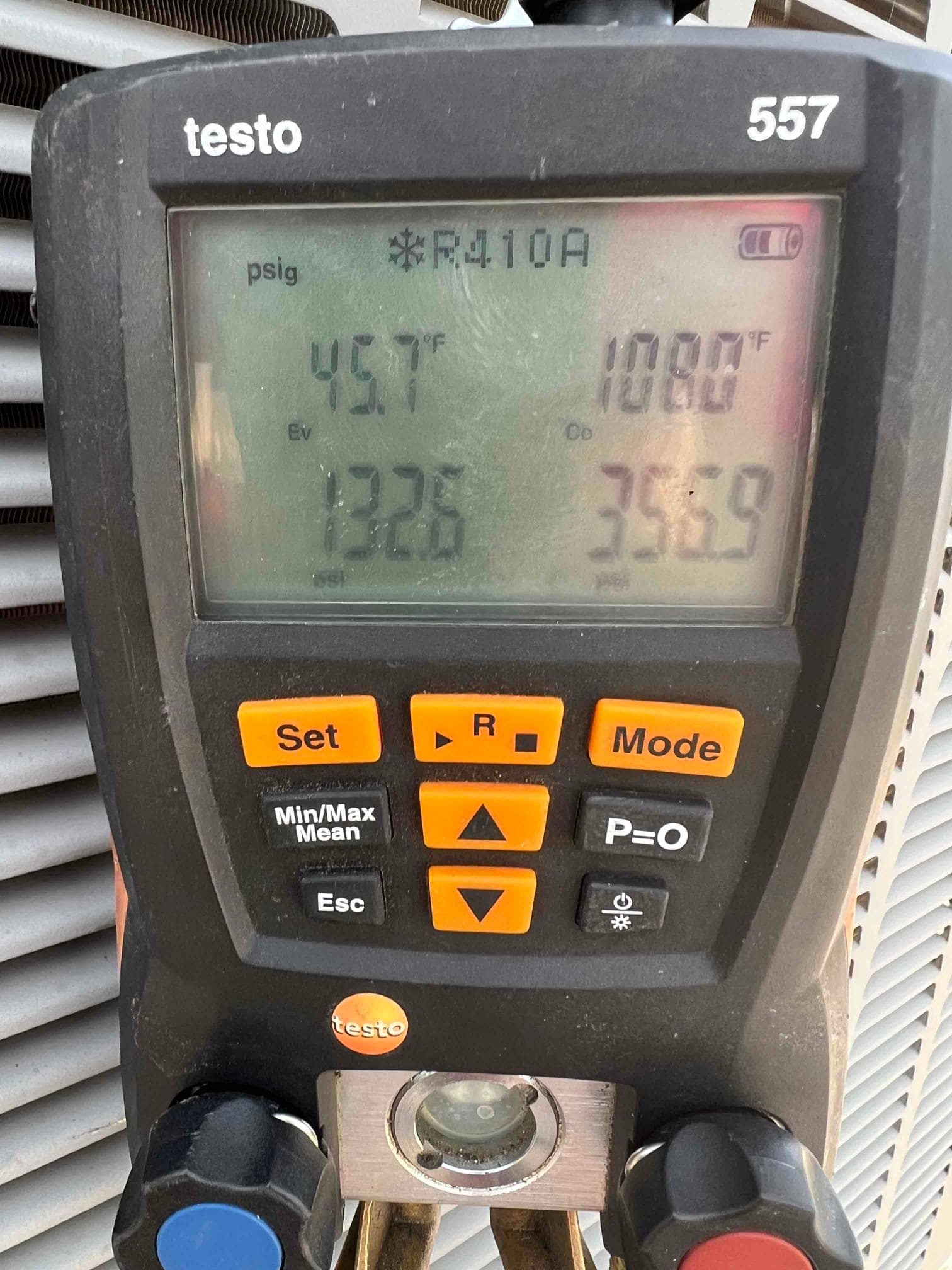 HVAC diagnostic instrument photographed during the service visit.