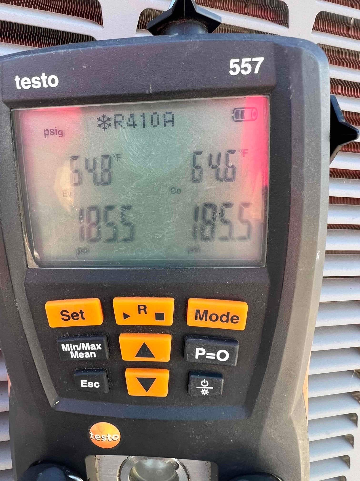HVAC diagnostic instrument photographed during the service visit.