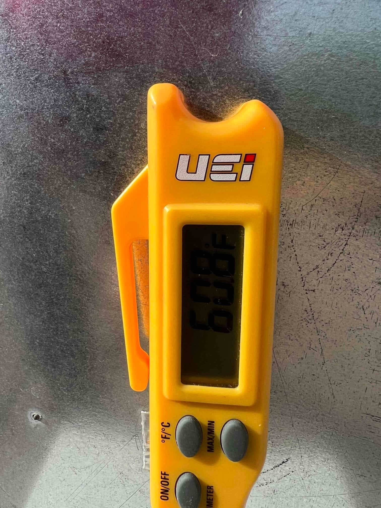 HVAC diagnostic instrument photographed during the service visit.