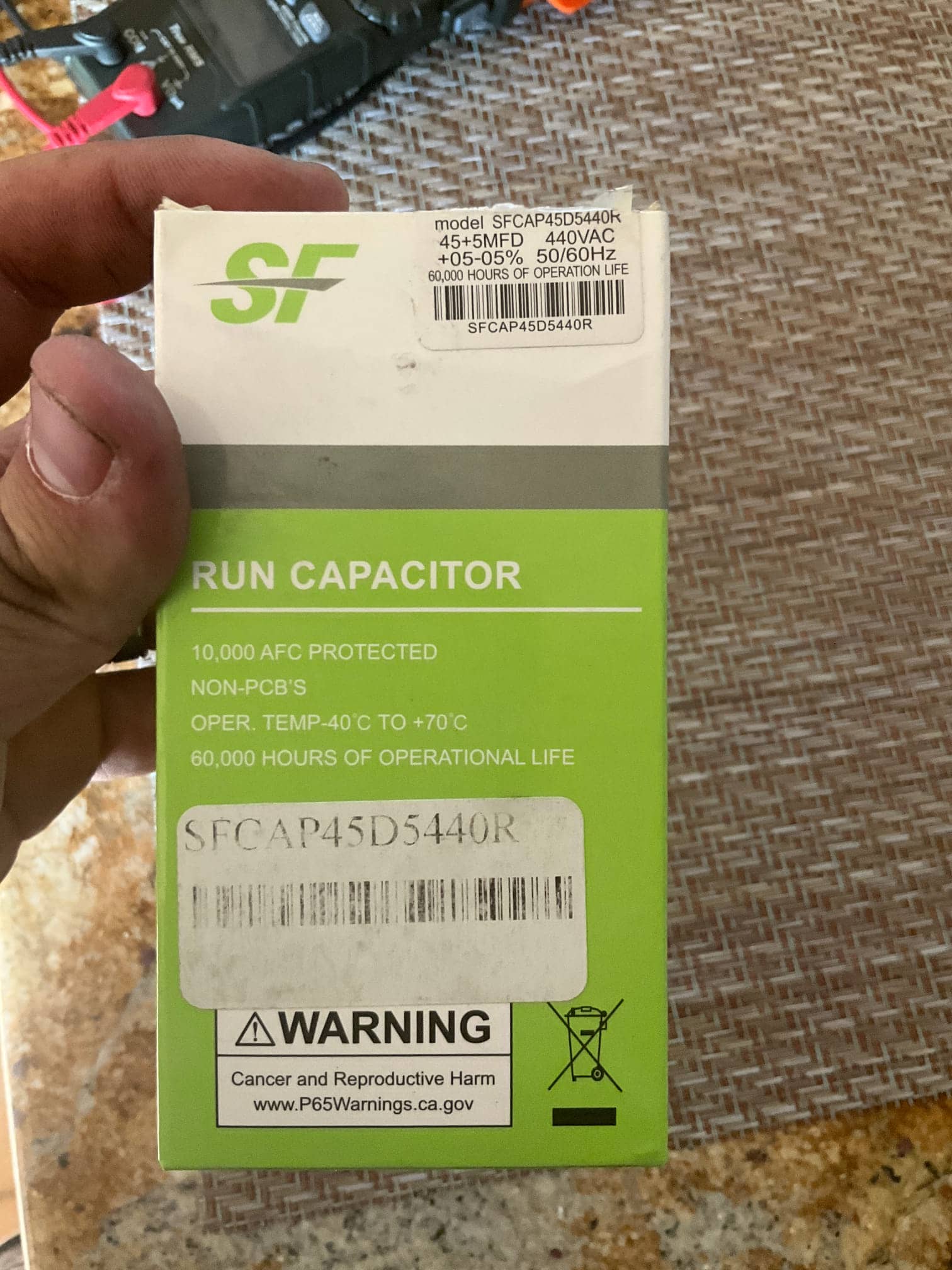 Run capacitor packaging showing printed specs: 45+5 MFD, 440VAC, -40°C to +70°C, non-PCB, 10,000 AFC protected.