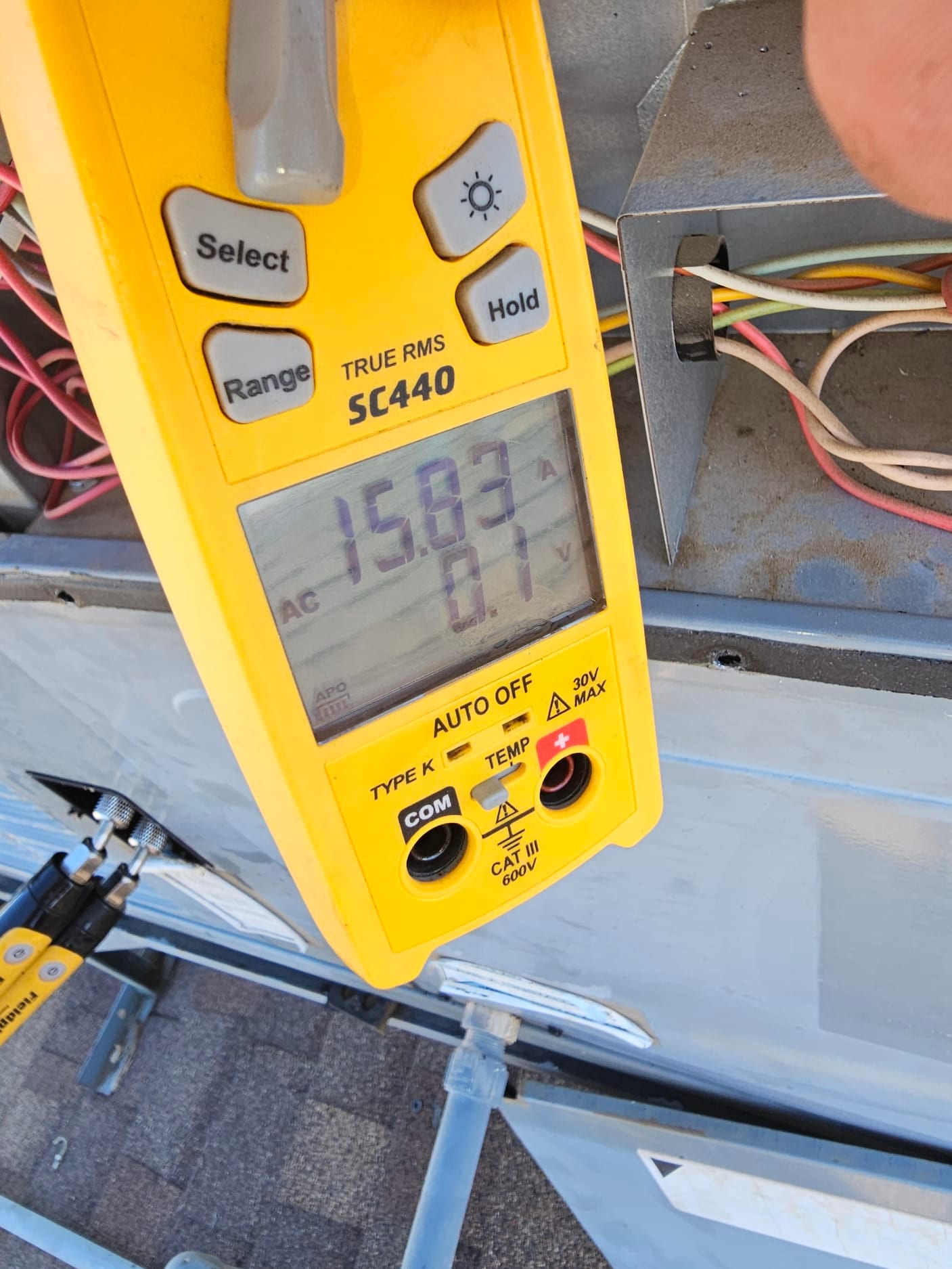 Diagnostic instrument display shows 15.83 A.