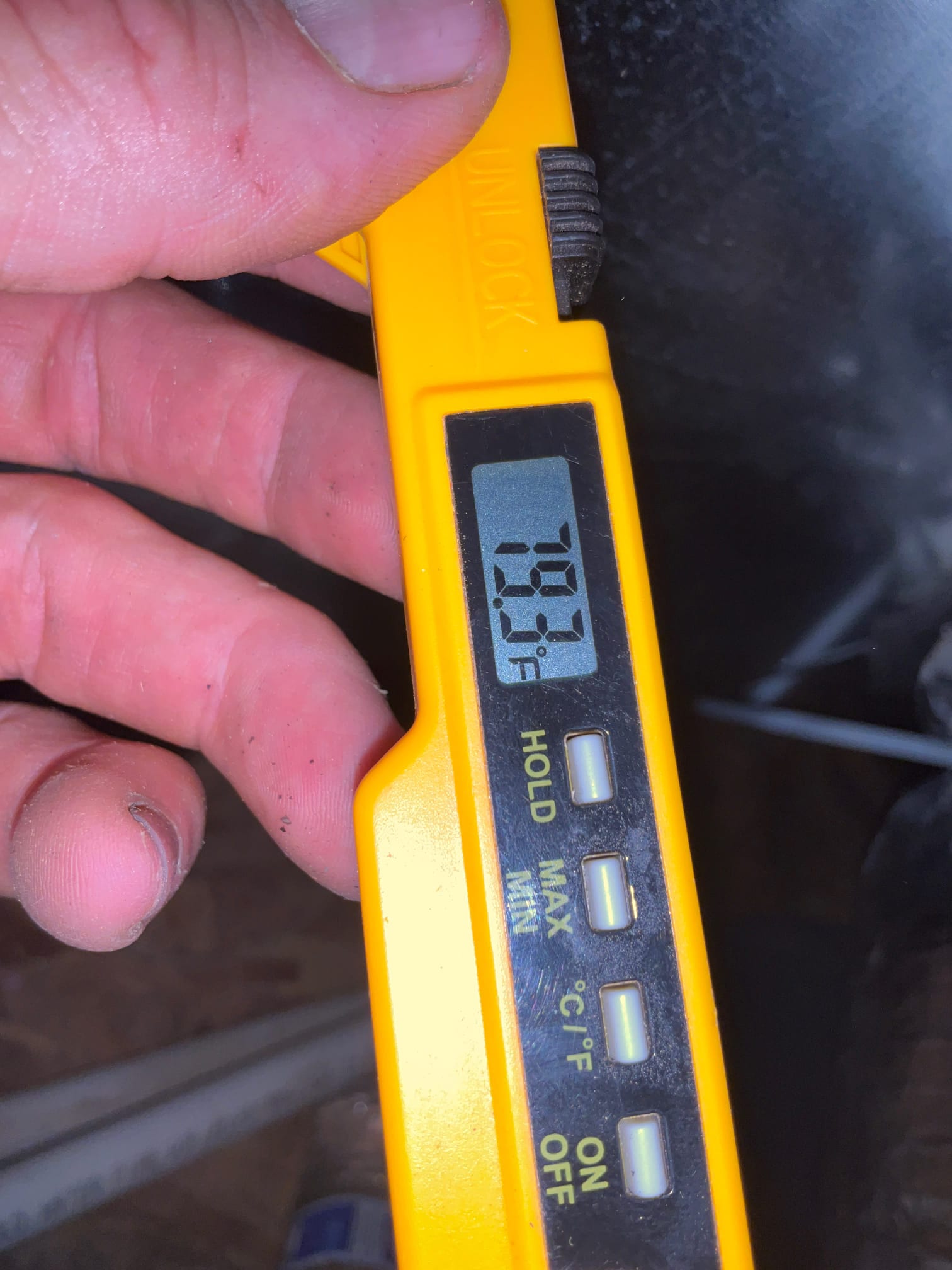 Digital thermometer shows 78.9°F during return air temperature check at the air handler.