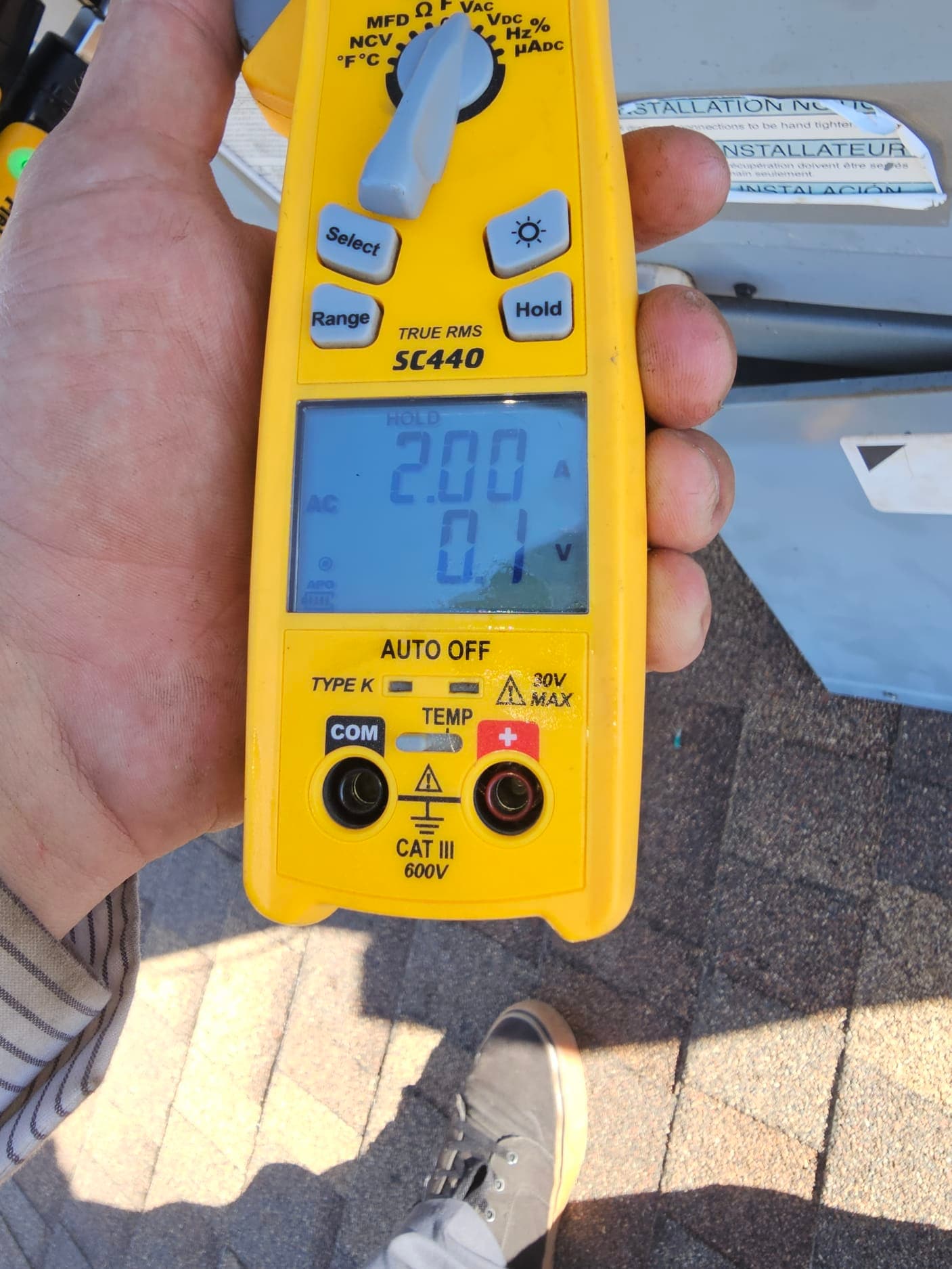 HVAC diagnostic instrument photographed during the service visit.
