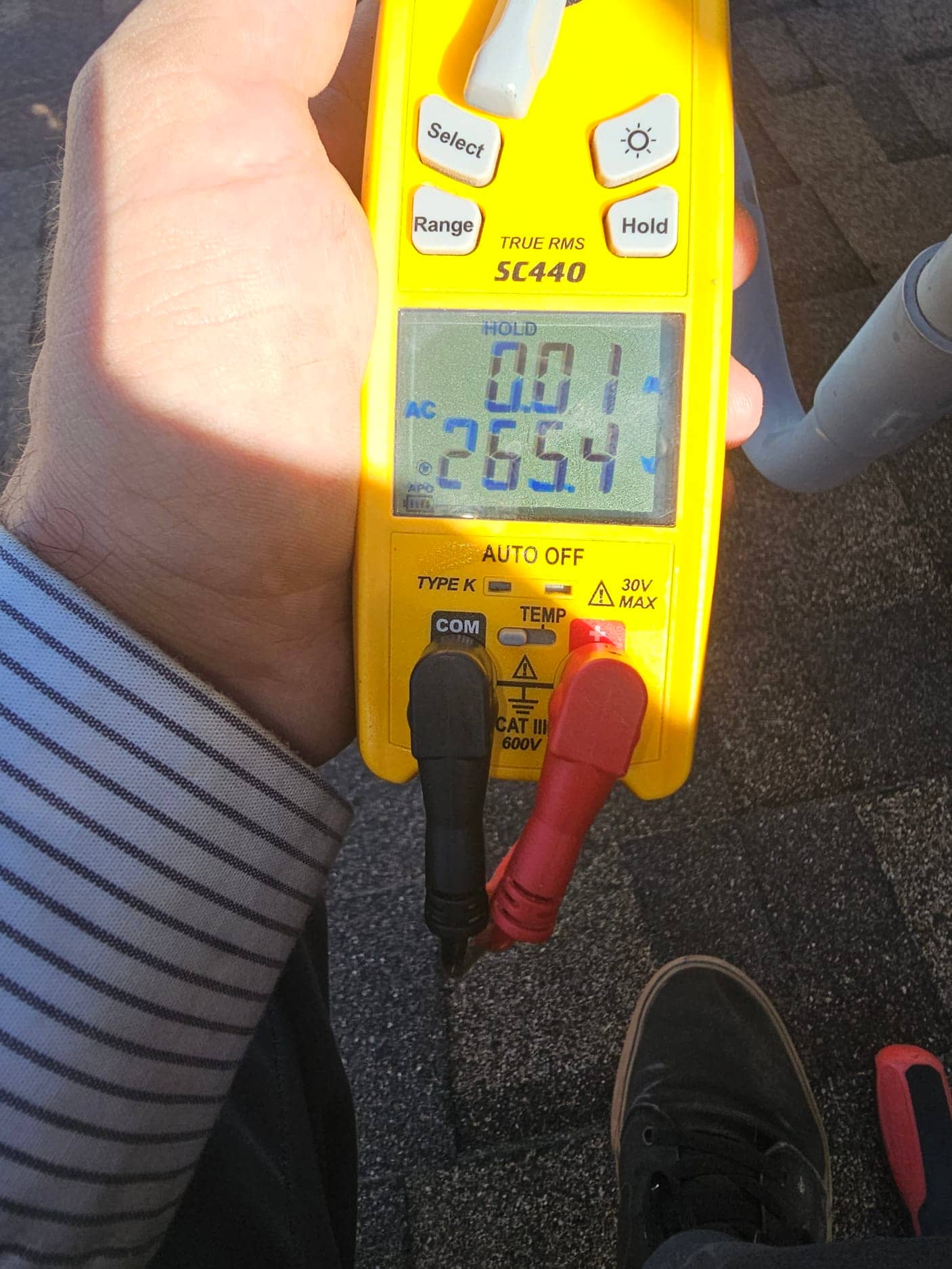 HVAC diagnostic instrument photographed during the service visit.