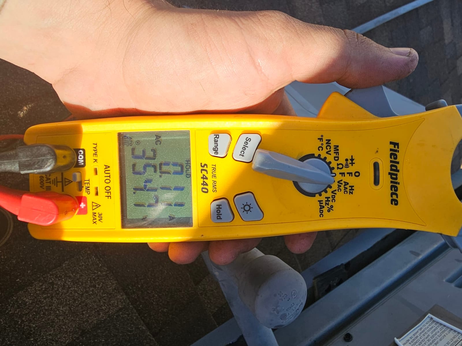 HVAC diagnostic instrument photographed during the service visit.