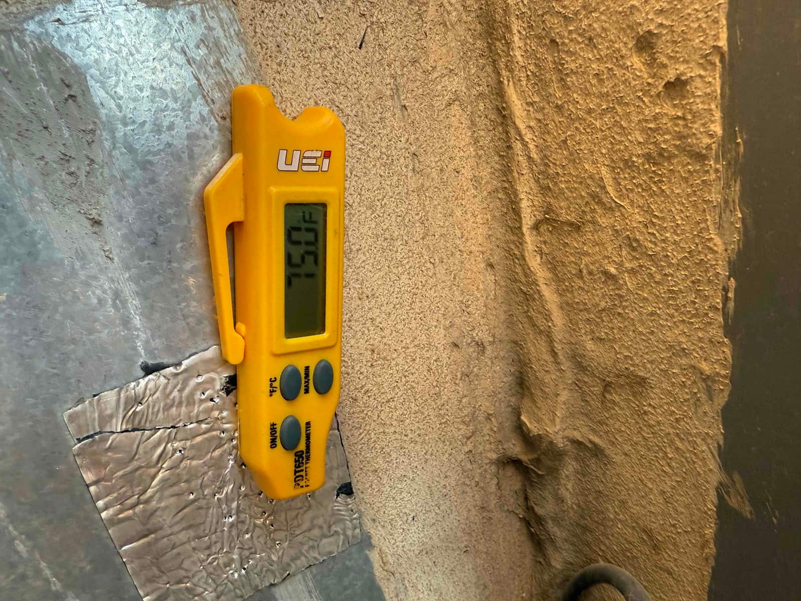 Capacitance meter displays 7.50 μF while measuring a capacitor in the HVAC system.