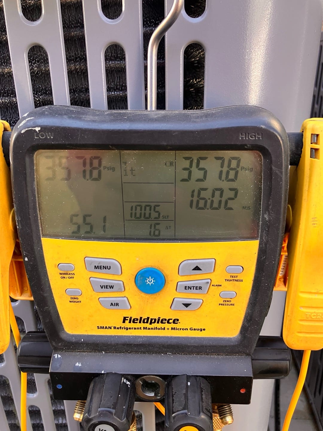 Digital manifold gauges show equal pressures at 3578 PSI on both sides during a nitrogen pressure test of the system.