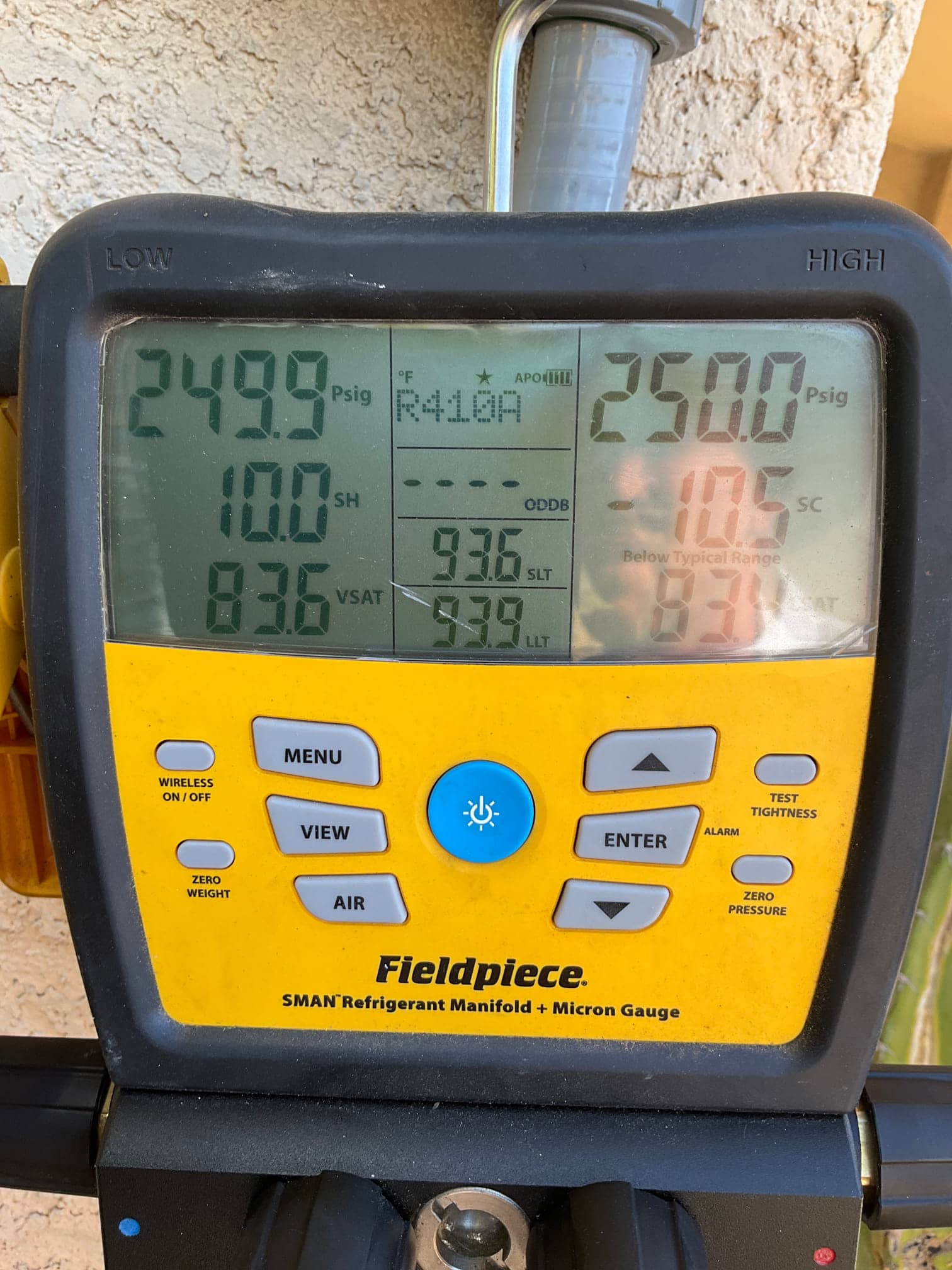 Digital manifold shows equal pressures around 2500 PSIG on both sides during a nitrogen pressure test of the new system.