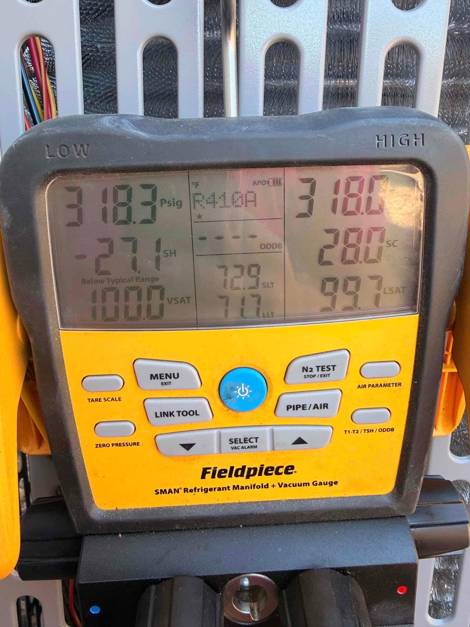 Digital manifold shows equal pressures around 318 PSI on both sides, documenting the nitrogen pressure test on the new system.