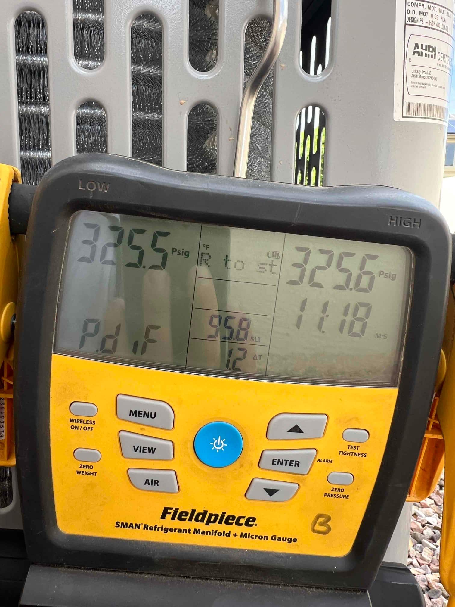 Digital manifold shows equal pressures around 325 PSI on both sides during a nitrogen pressure test of the new system.