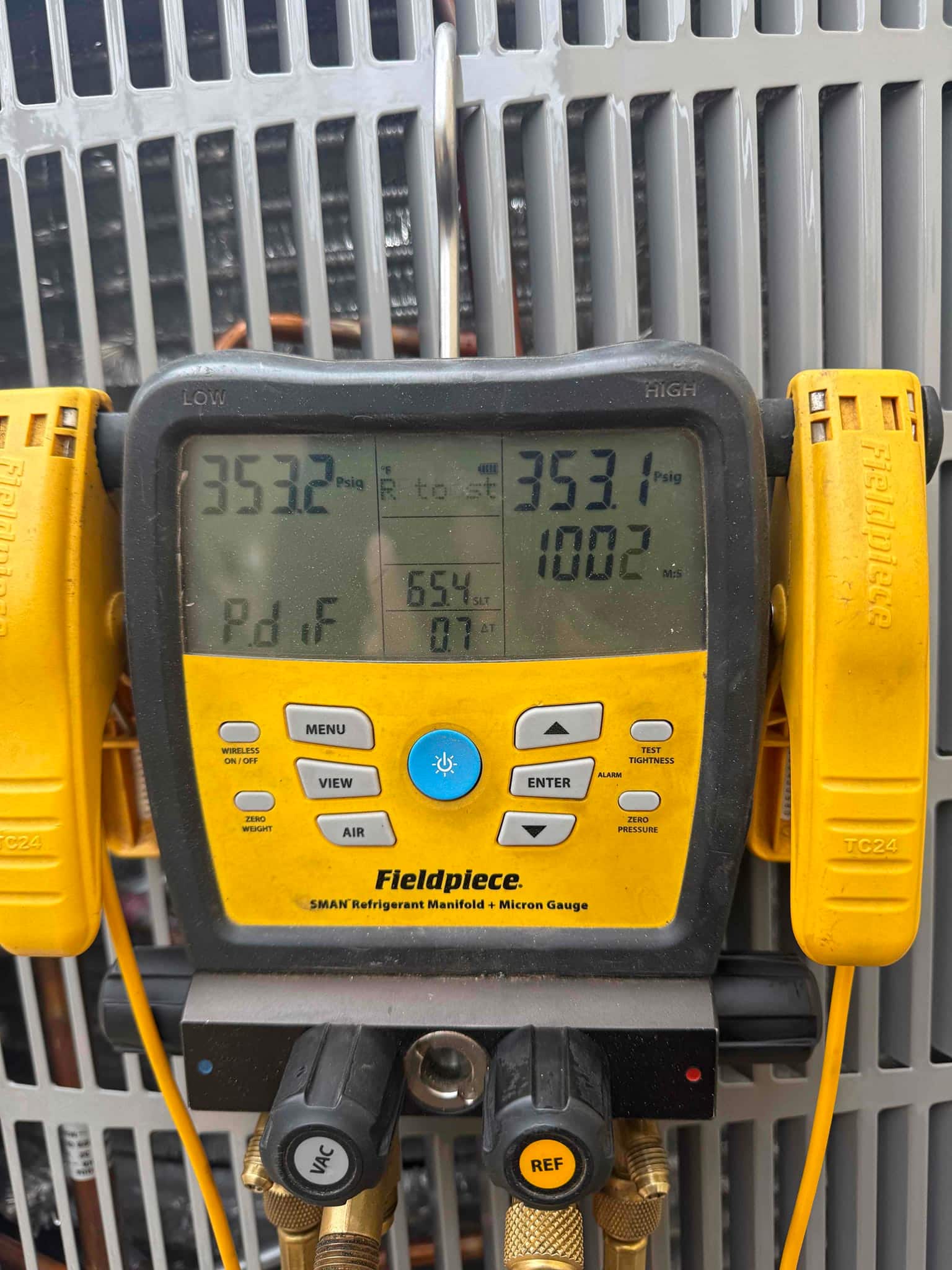 Digital manifold shows equal pressures around 353 PSI on both sides during a nitrogen pressure test of the new system.