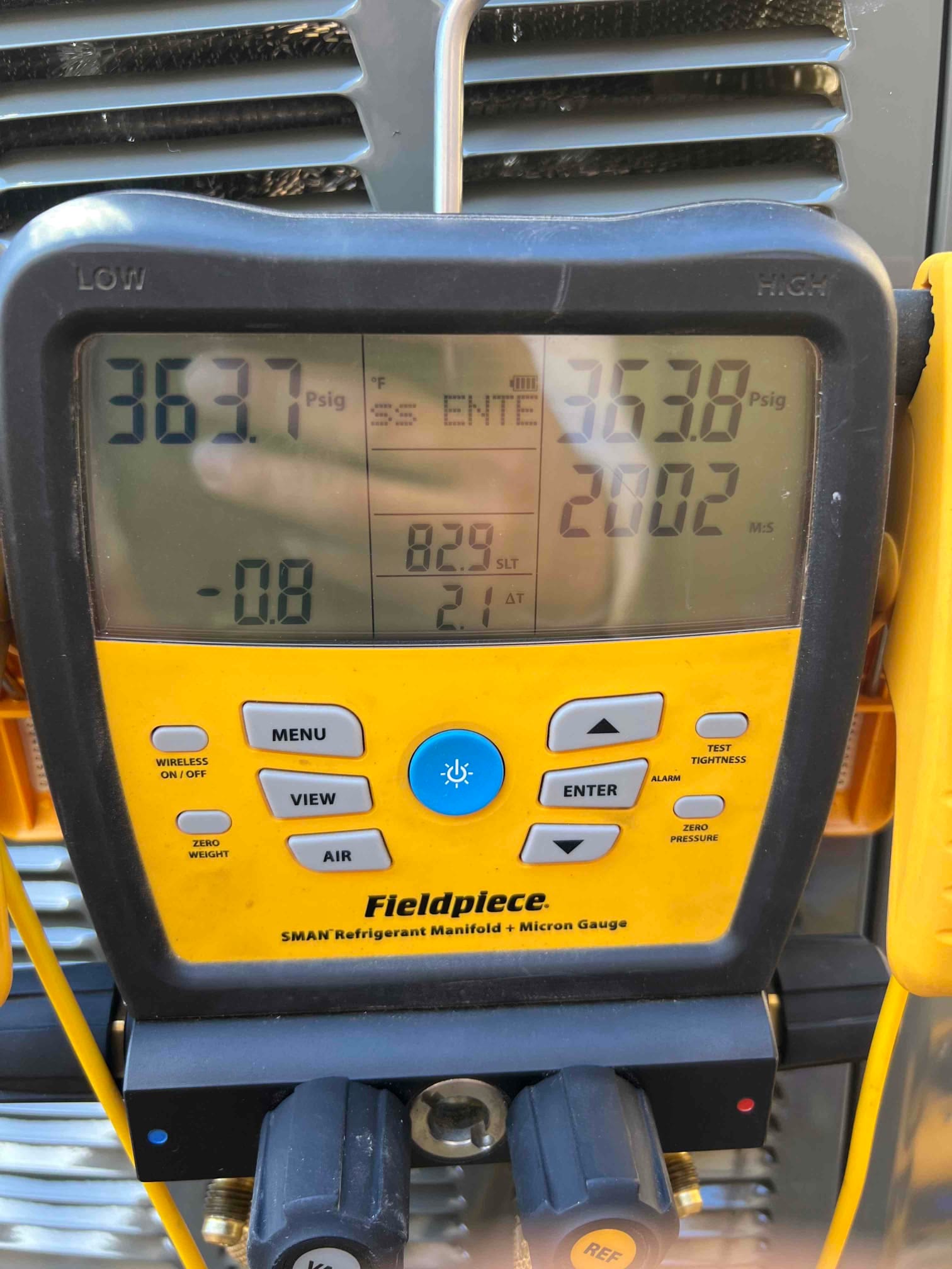 Digital manifold shows equal pressures around 364 PSI on both sides during a nitrogen pressure test of the system.
