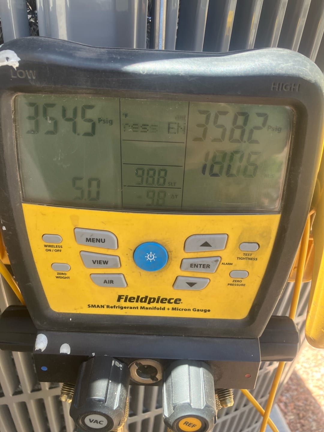 Digital manifold shows equalized pressures around the mid-350 PSI range on both sides during a nitrogen pressure test.