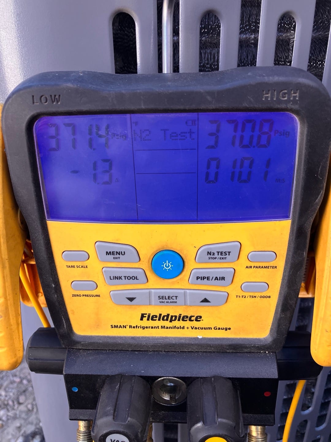 Digital manifold shows both sides holding around 371 and 371 PSI during a nitrogen pressure test on the new system.