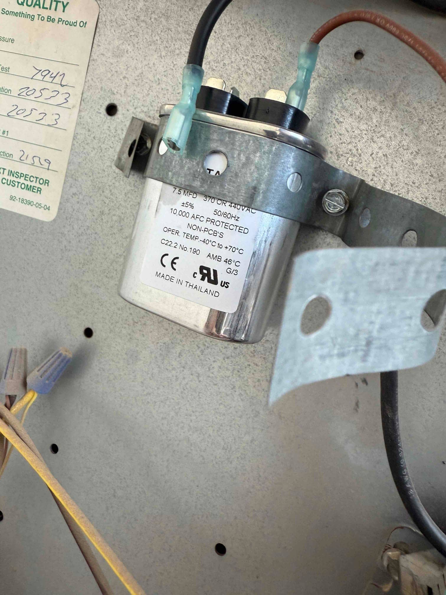 Dual-run capacitor mounted inside the condenser panel, rated 45/5 μF at 440 VAC, with insulated terminals and secured metal strap.