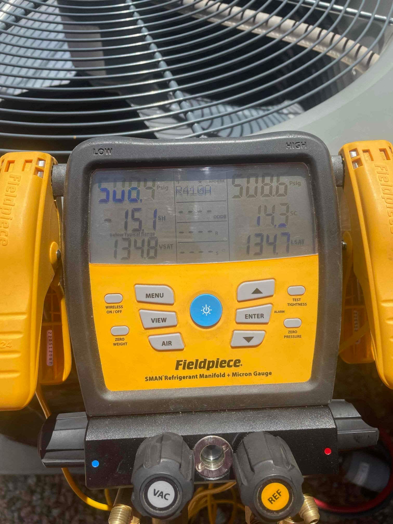 HVAC diagnostic instrument photographed during the service visit.