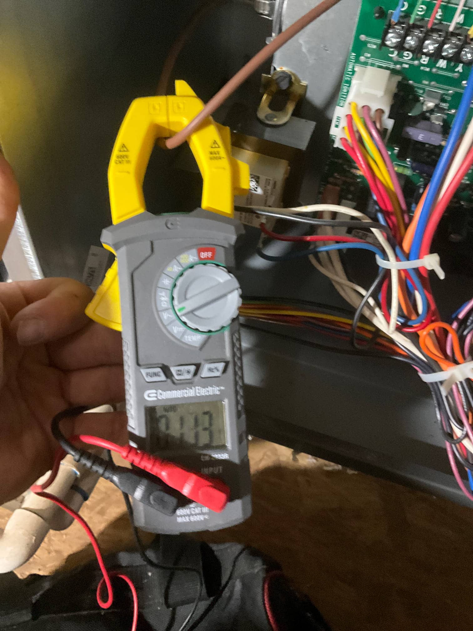 HVAC diagnostic instrument photographed during the service visit.