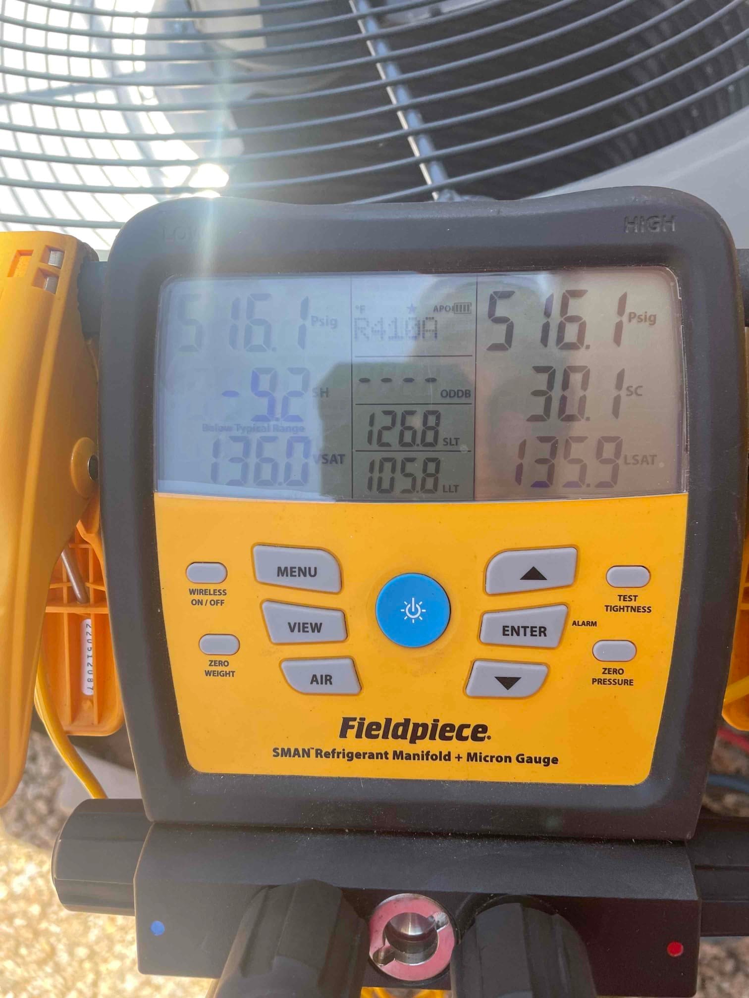 HVAC diagnostic instrument photographed during the service visit.