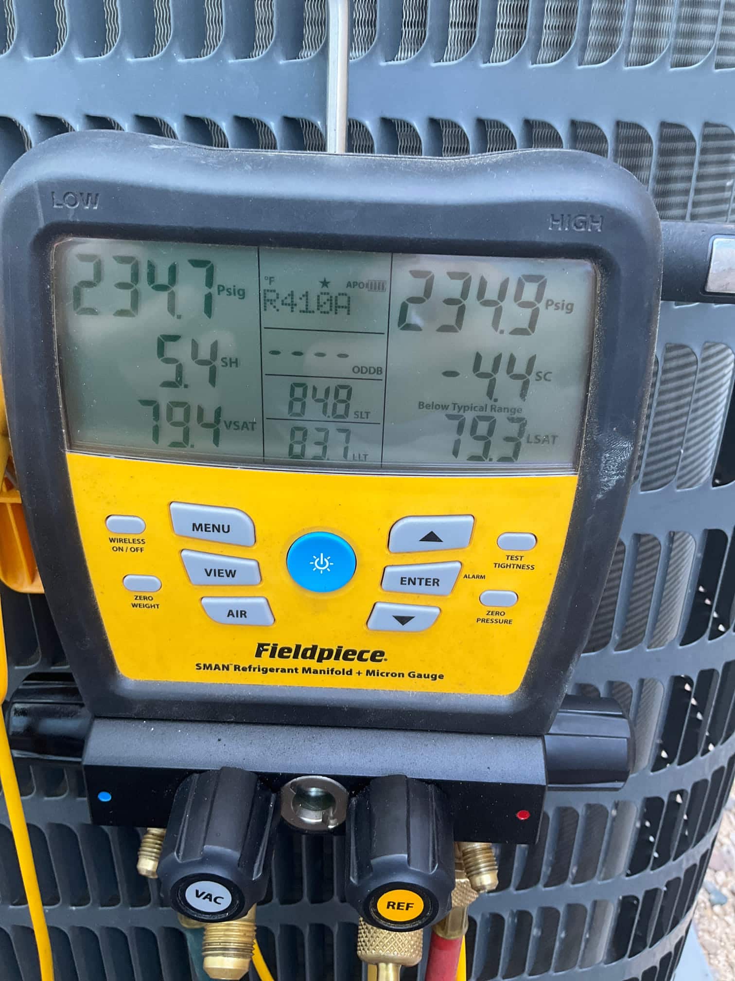 HVAC diagnostic instrument photographed during the service visit.