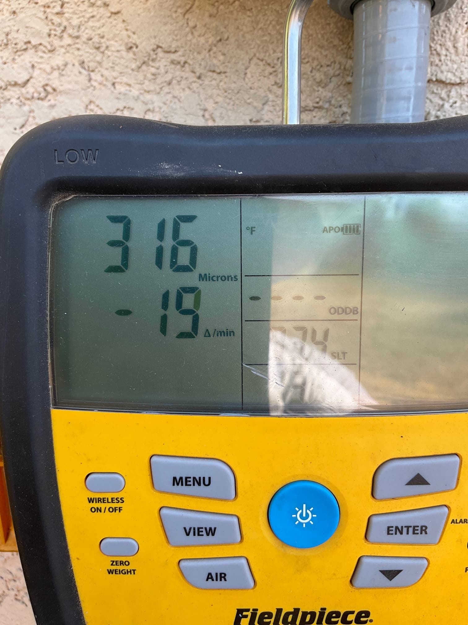 Micron gauge displays 316 microns with a decay rate of 19 per minute during system evacuation.
