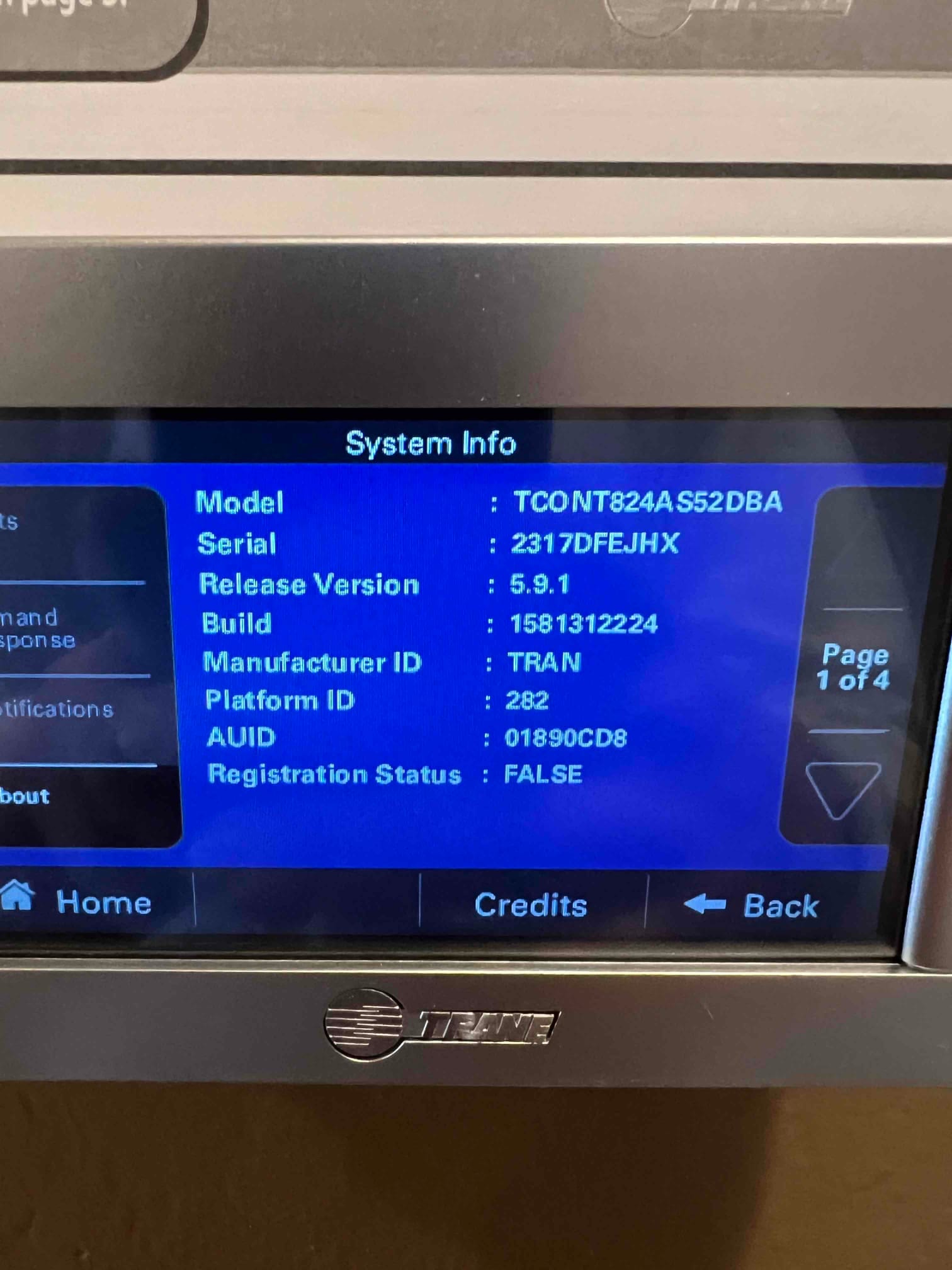 Thermostat system information screen displayed after installation, showing model, serial, and software version details.