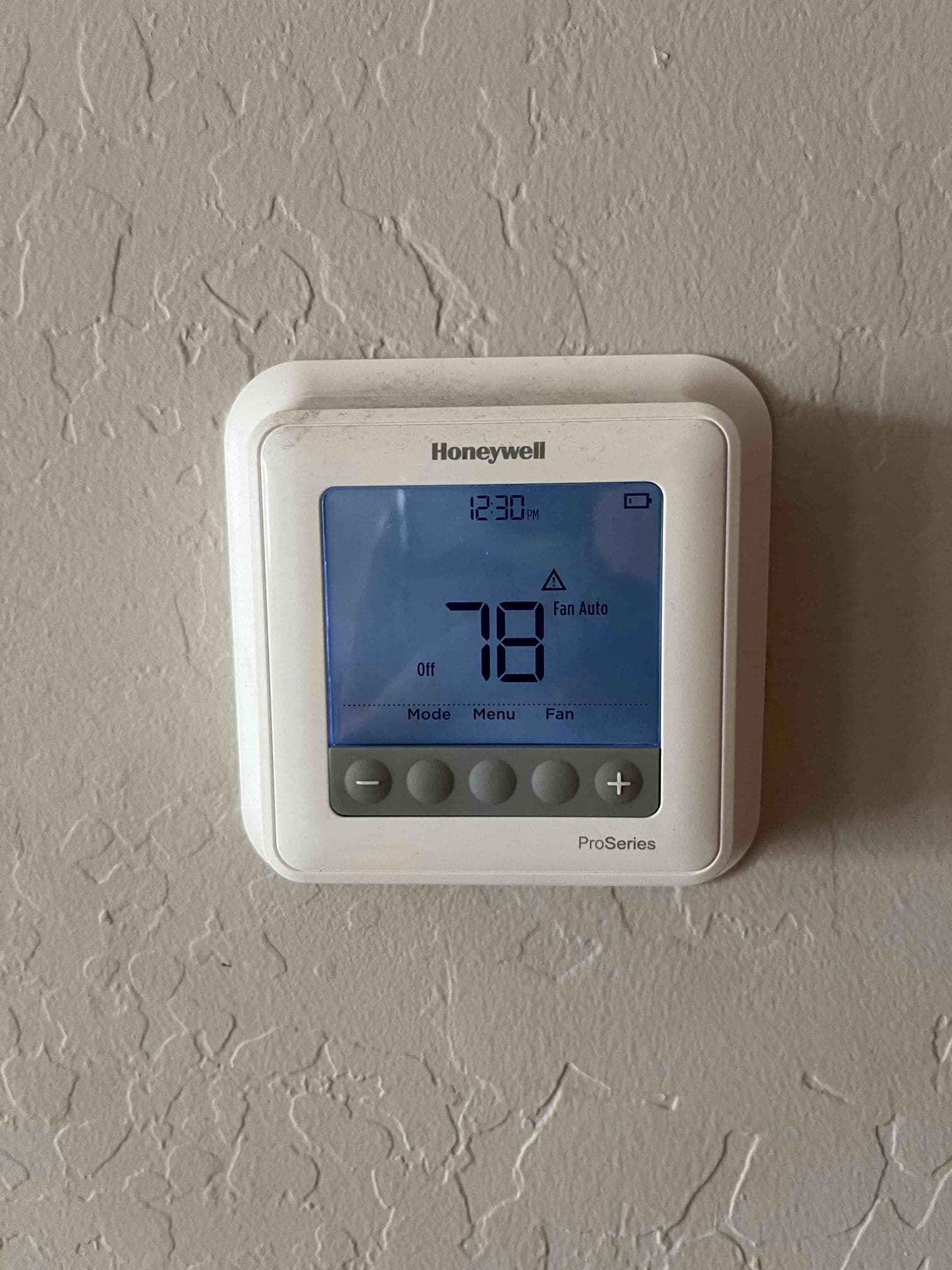 Wall-mounted digital thermostat displays 78 degrees with system set to Off and fan set to Auto.