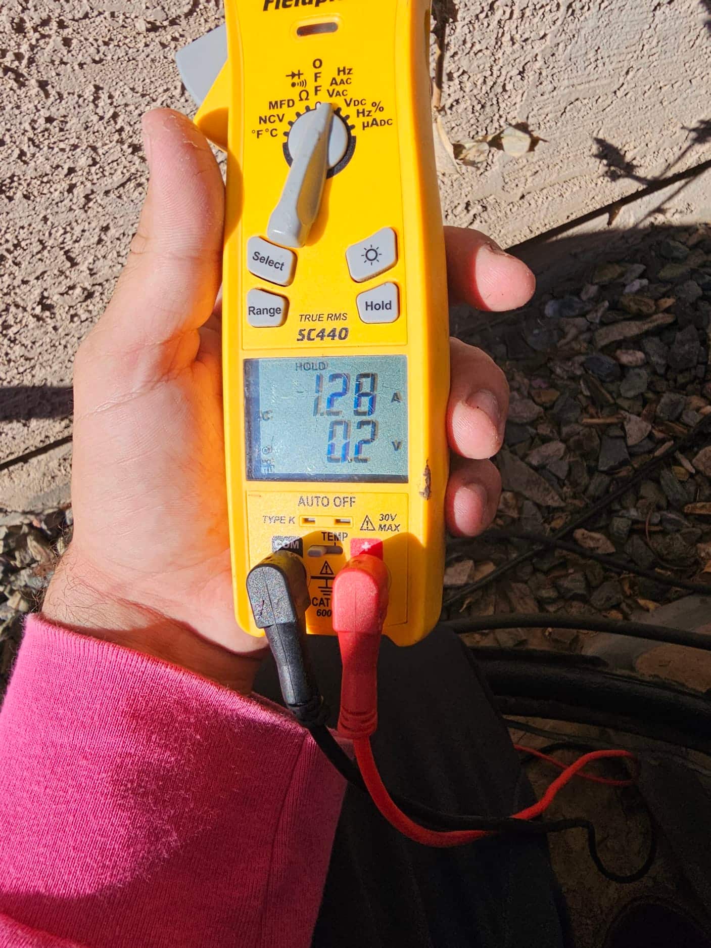 Diagnostic instrument display shows 1.28 A.