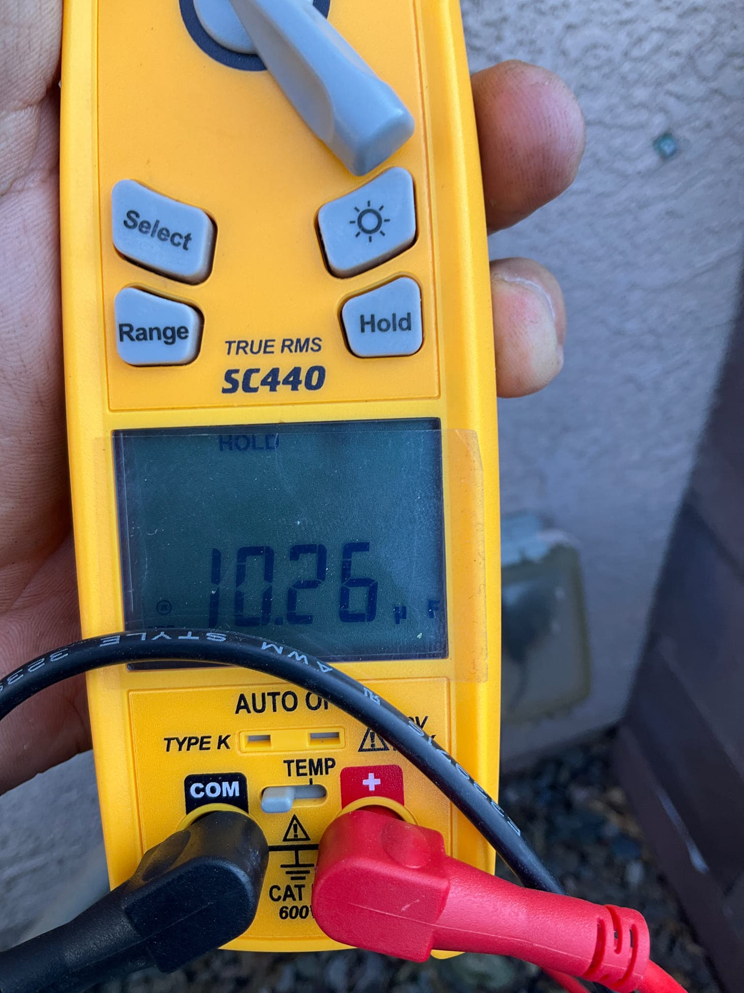 Diagnostic instrument display shows 10.26 μF.