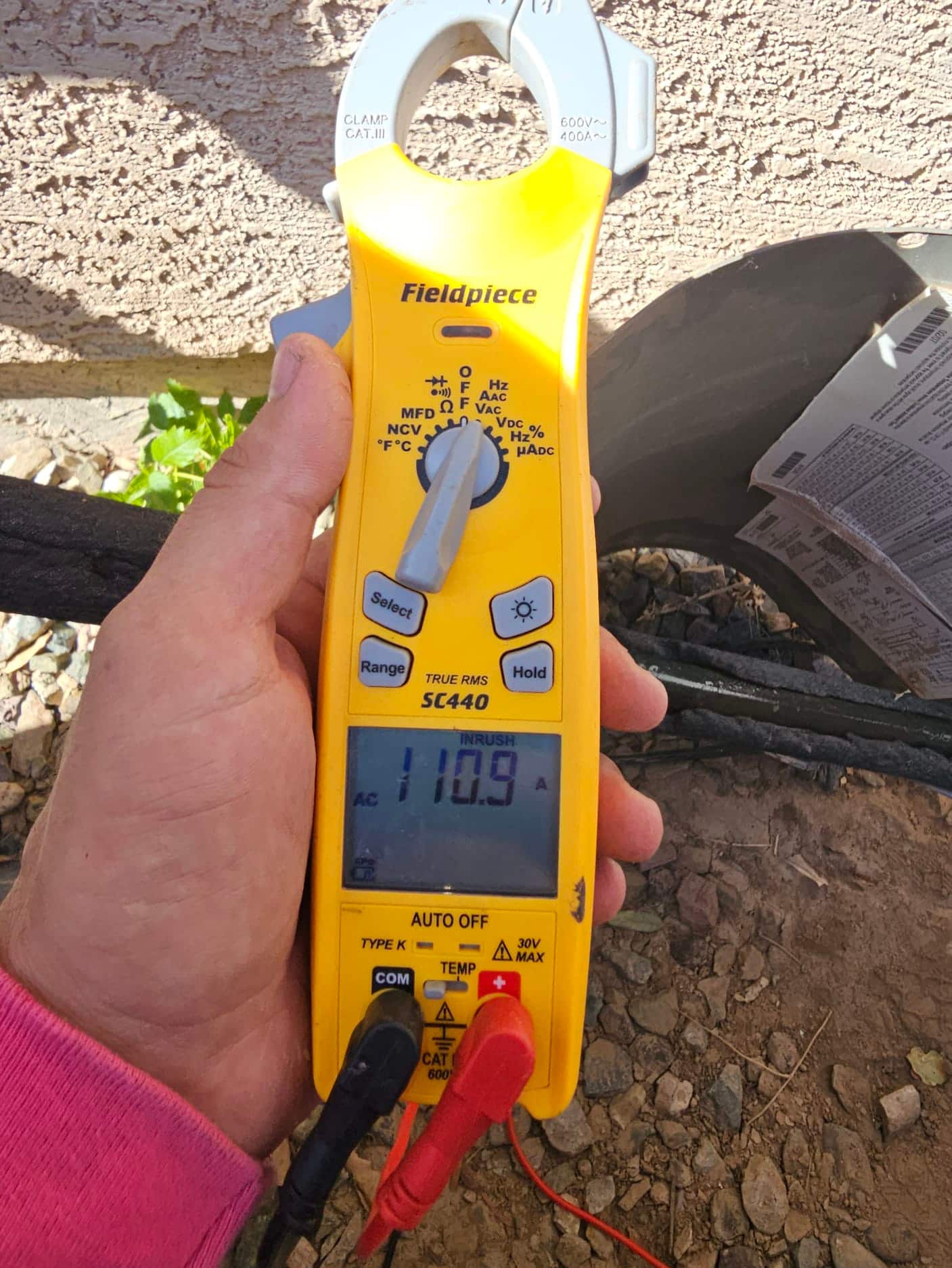 Diagnostic instrument display shows 110.9 A.