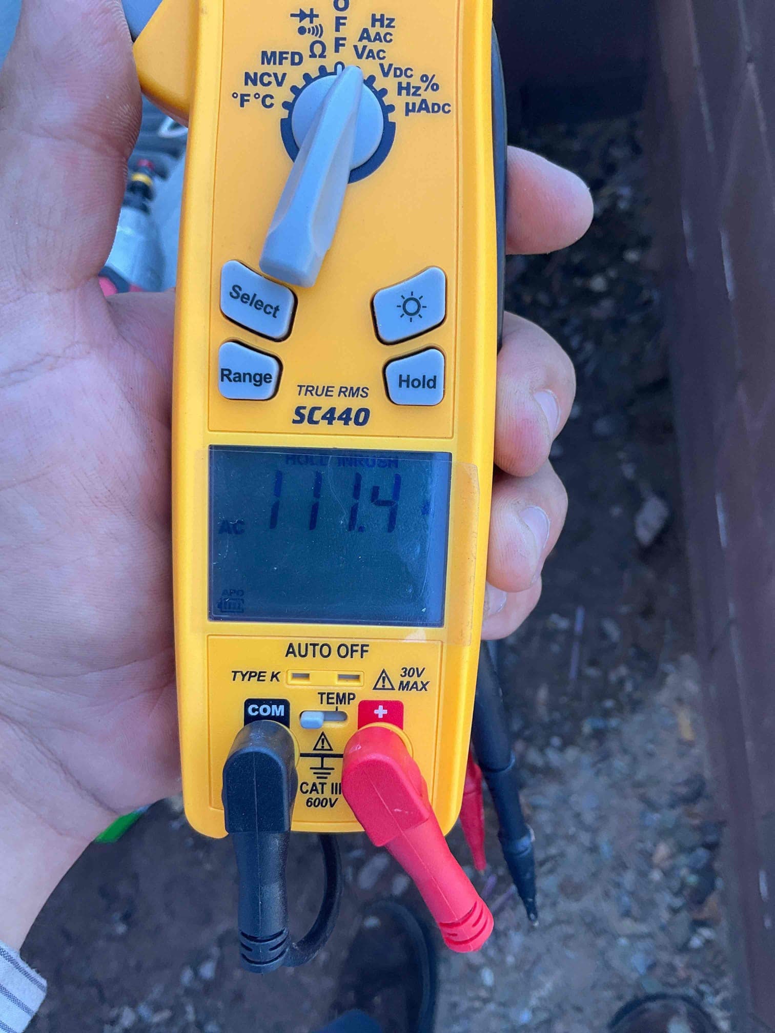 Diagnostic instrument display shows 111.4 A.