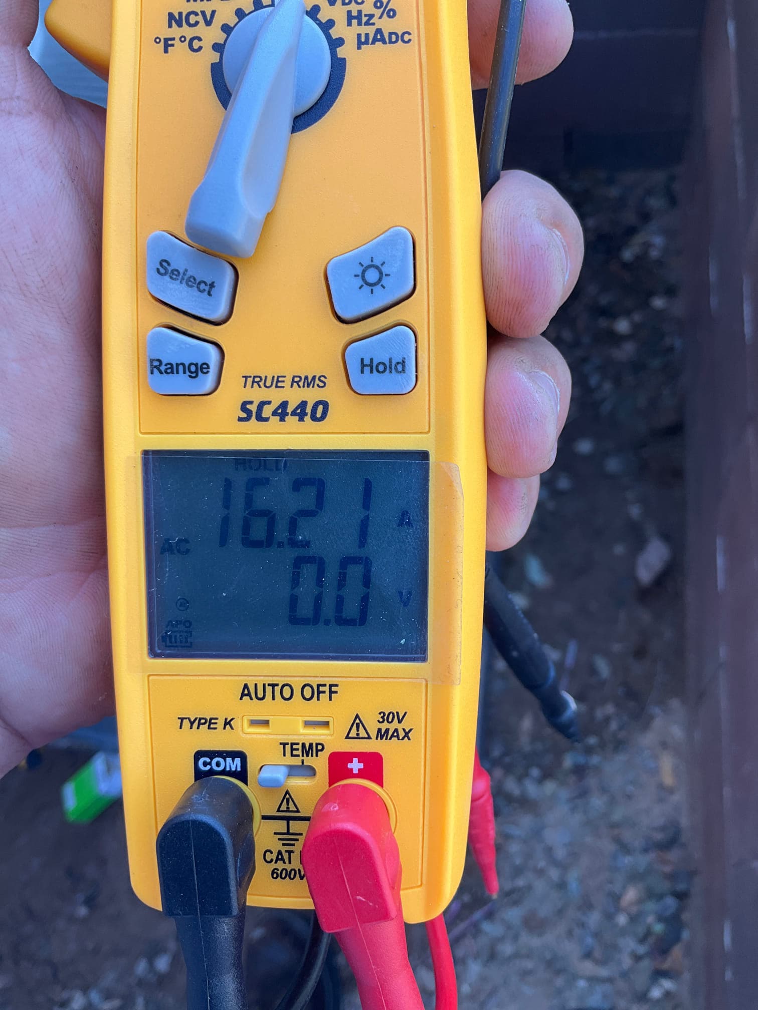Diagnostic instrument display shows 16.21 A.