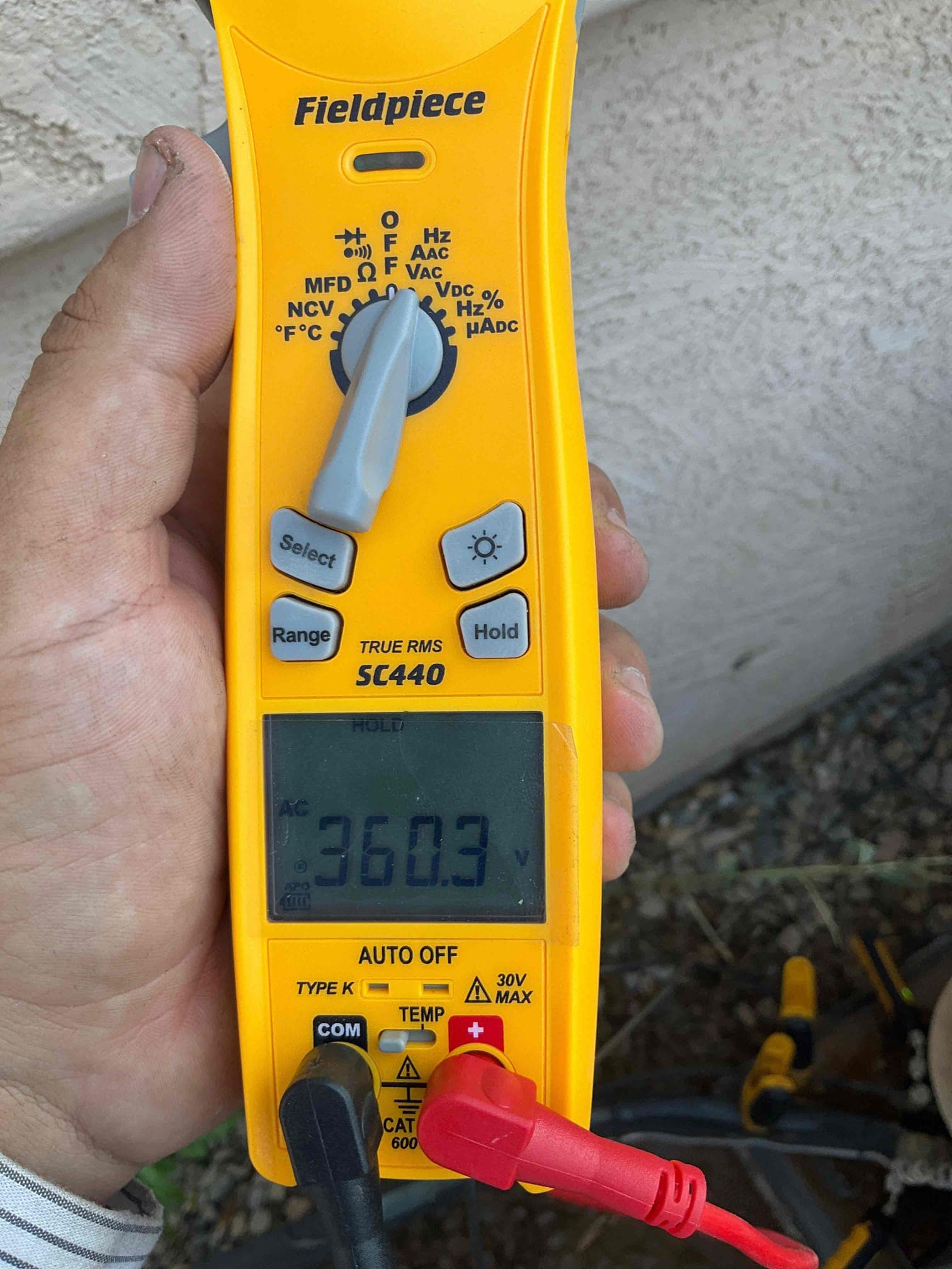 Diagnostic instrument display shows 360.3 V.