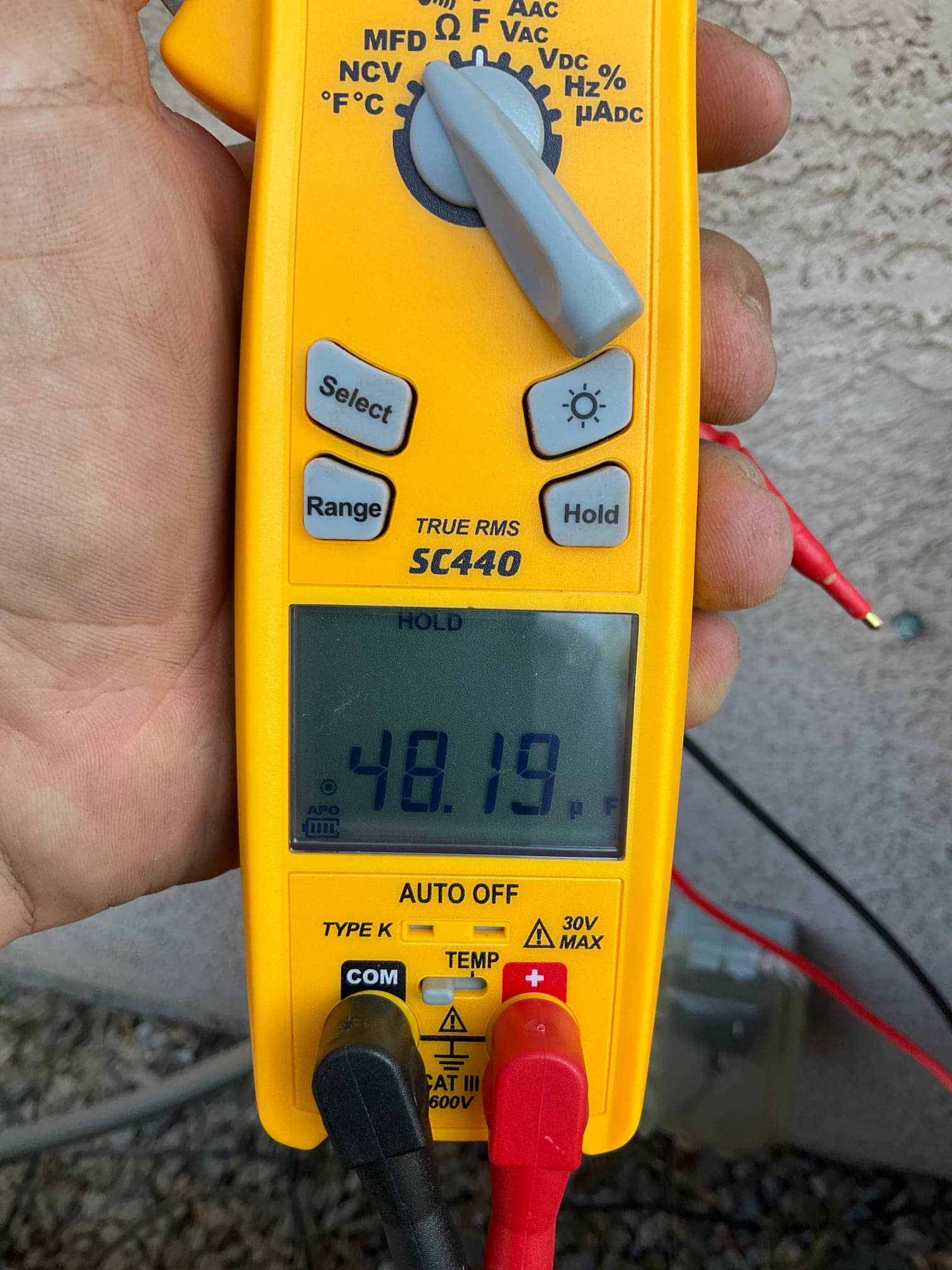 Diagnostic instrument display shows 48.19 μF.