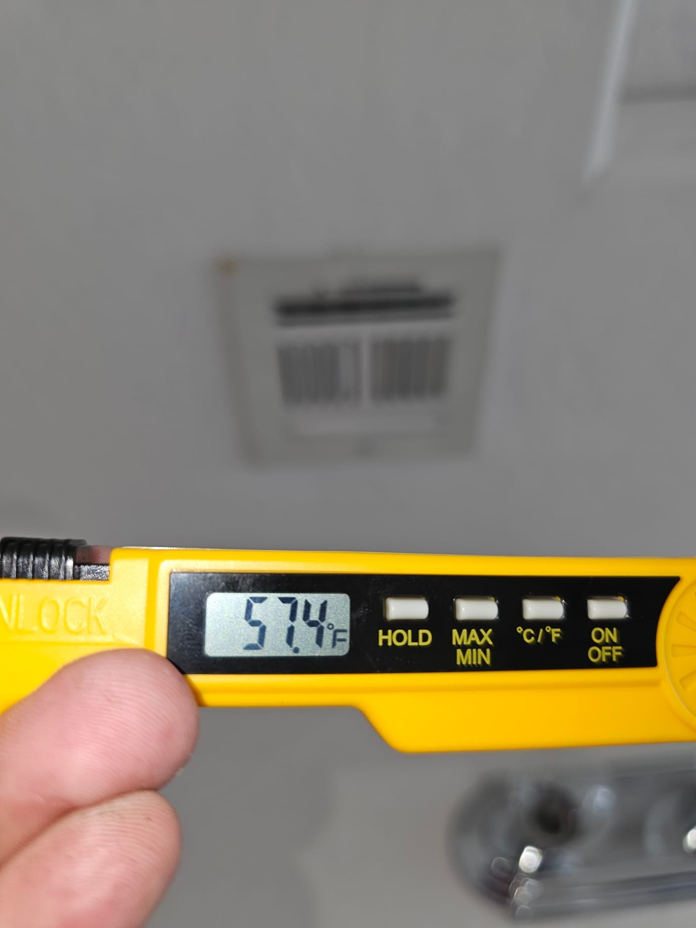 Diagnostic instrument display shows 57.4 °F.