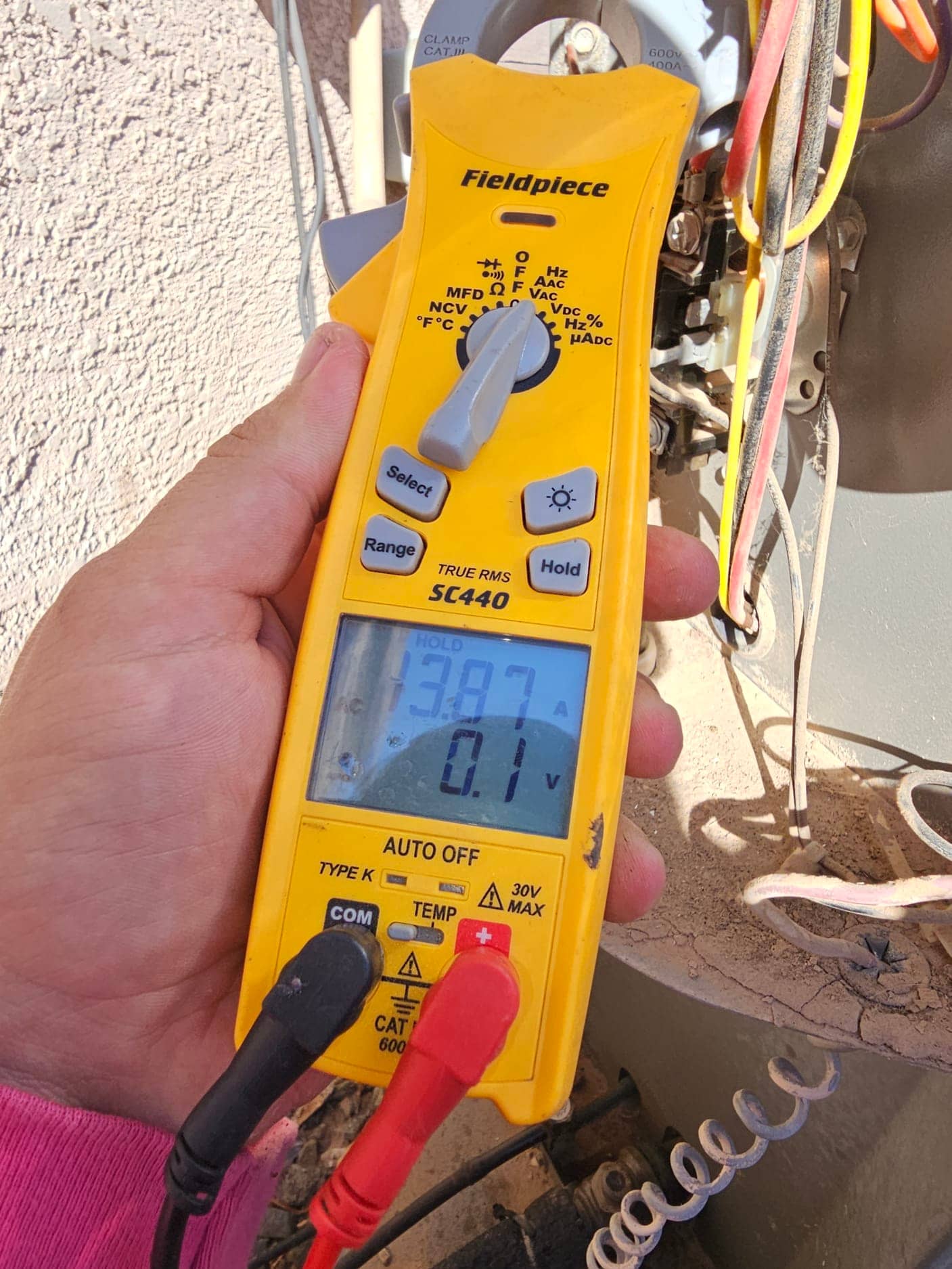 HVAC diagnostic instrument photographed during the service visit.